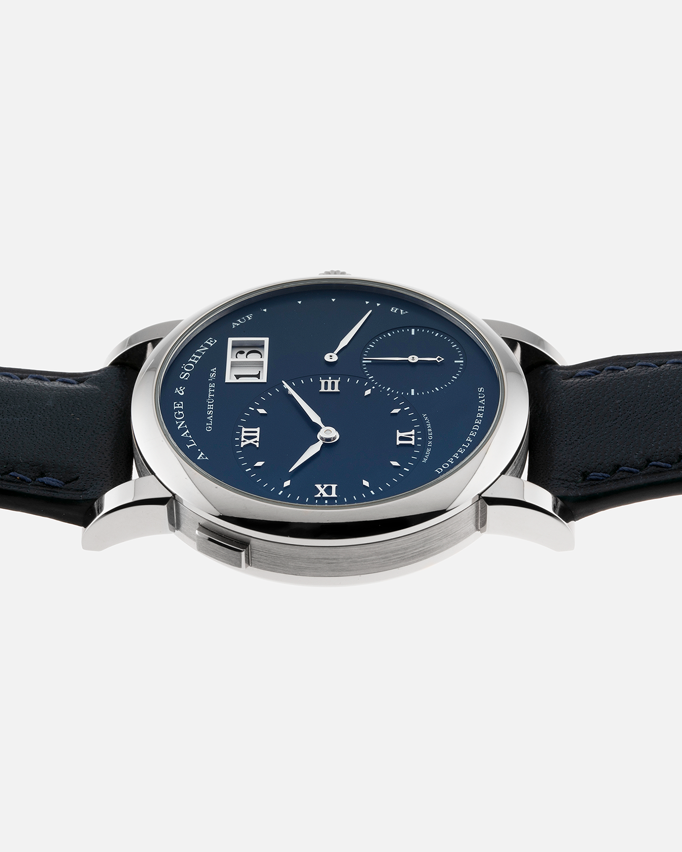 Brand: A. Lange & Söhne Year: 2017 Model: Lange 1 Reference Number: 191.028 Material: 18-carat White Gold Movement: Cal. L121.1, Manual-Winding Case Diameter: 38.5mm Bracelet/Strap: Dark Blue Calf Strap and A. Lange & Söhne Dark Blue Alligator Leather with Signed Tang Buckle 