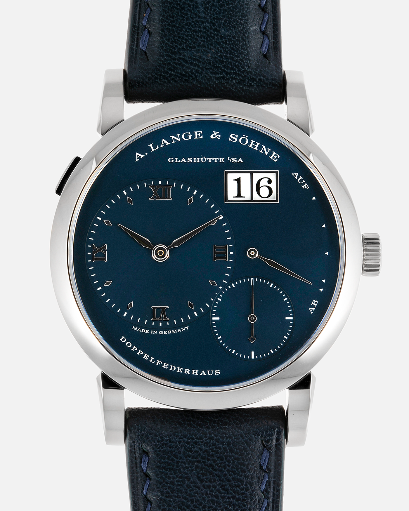 Brand: A. Lange & Söhne Year: 2017 Model: Lange 1 Reference Number: 191.028 Material: 18-carat White Gold Movement: Cal. L121.1, Manual-Winding Case Diameter: 38.5mm Bracelet/Strap: Dark Blue Calf Strap and A. Lange & Söhne Dark Blue Alligator Leather with Signed Tang Buckle 