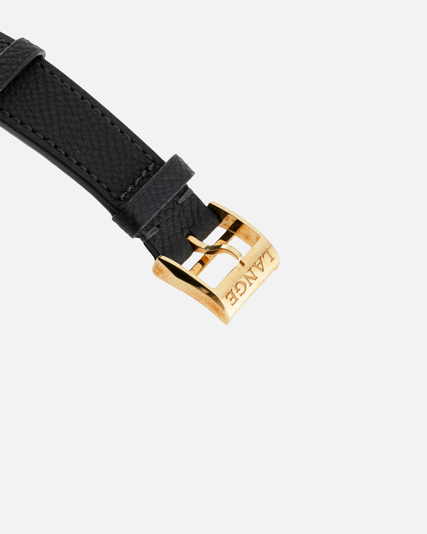 Brand: A. Lange & Söhne Year: 2000’s Model: Lange 1 Reference Number: 101.027 Material: 18-carat Yellow Gold Movement: Cal. L901.0, Manual-Winding Case Diameter: 38.5mm Bracelet/Strap: Molequin Anthracite Textured Calf Strap and A. Lange & Sohne Black Alligator Strap with 18k Yellow Gold Tang Buckle
