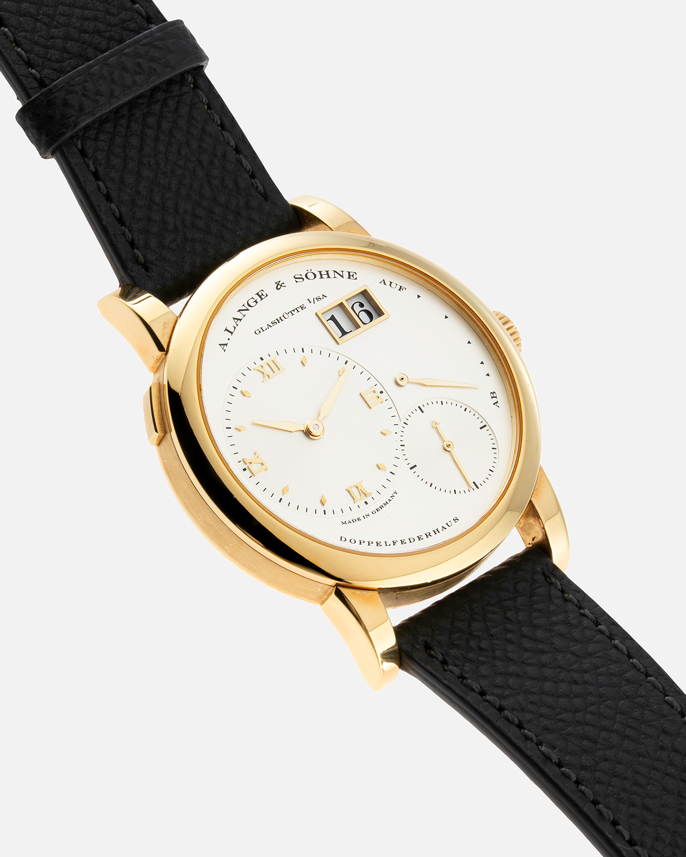 Brand: A. Lange & Söhne Year: 2000’s Model: Lange 1 Reference Number: 101.027 Material: 18-carat Yellow Gold Movement: Cal. L901.0, Manual-Winding Case Diameter: 38.5mm Bracelet/Strap: Molequin Anthracite Textured Calf Strap and A. Lange & Sohne Black Alligator Strap with 18k Yellow Gold Tang Buckle