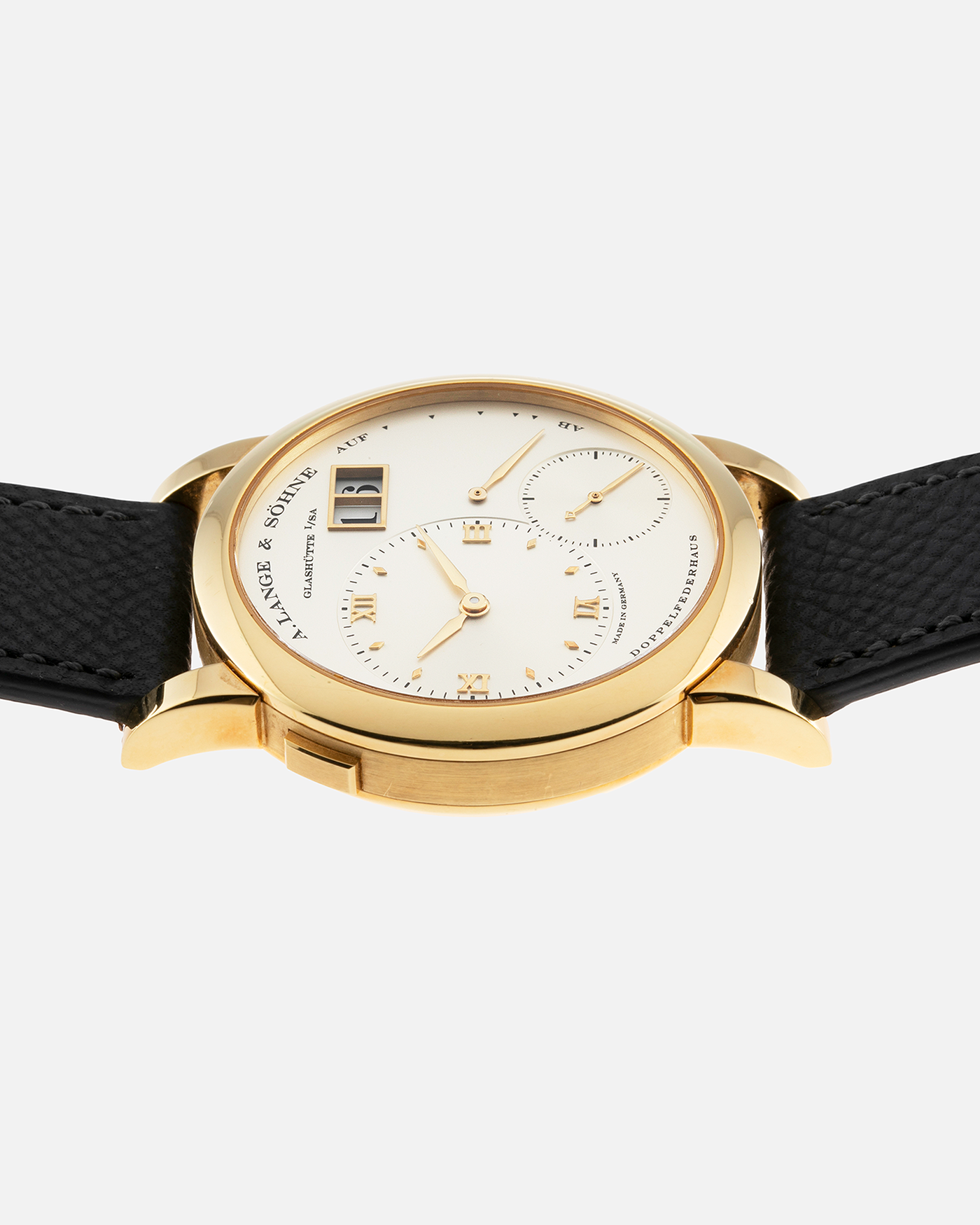 Brand: A. Lange & Söhne Year: 2000’s Model: Lange 1 Reference Number: 101.027 Material: 18-carat Yellow Gold Movement: Cal. L901.0, Manual-Winding Case Diameter: 38.5mm Bracelet/Strap: Molequin Anthracite Textured Calf Strap and A. Lange & Sohne Black Alligator Strap with 18k Yellow Gold Tang Buckle