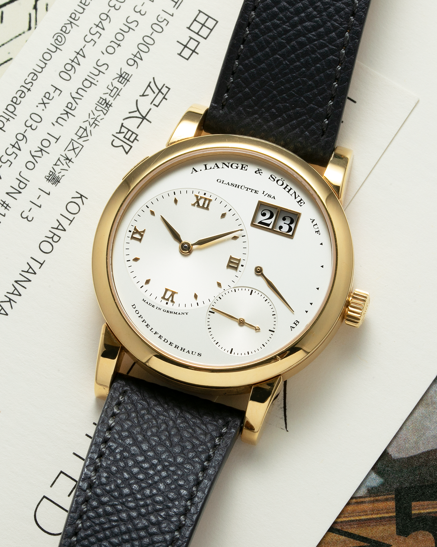 Brand: A. Lange & Söhne Year: 2000’s Model: Lange 1 Reference Number: 101.027 Material: 18-carat Yellow Gold Movement: Cal. L901.0, Manual-Winding Case Diameter: 38.5mm Bracelet/Strap: Molequin Anthracite Textured Calf Strap and A. Lange & Sohne Black Alligator Strap with 18k Yellow Gold Tang Buckle