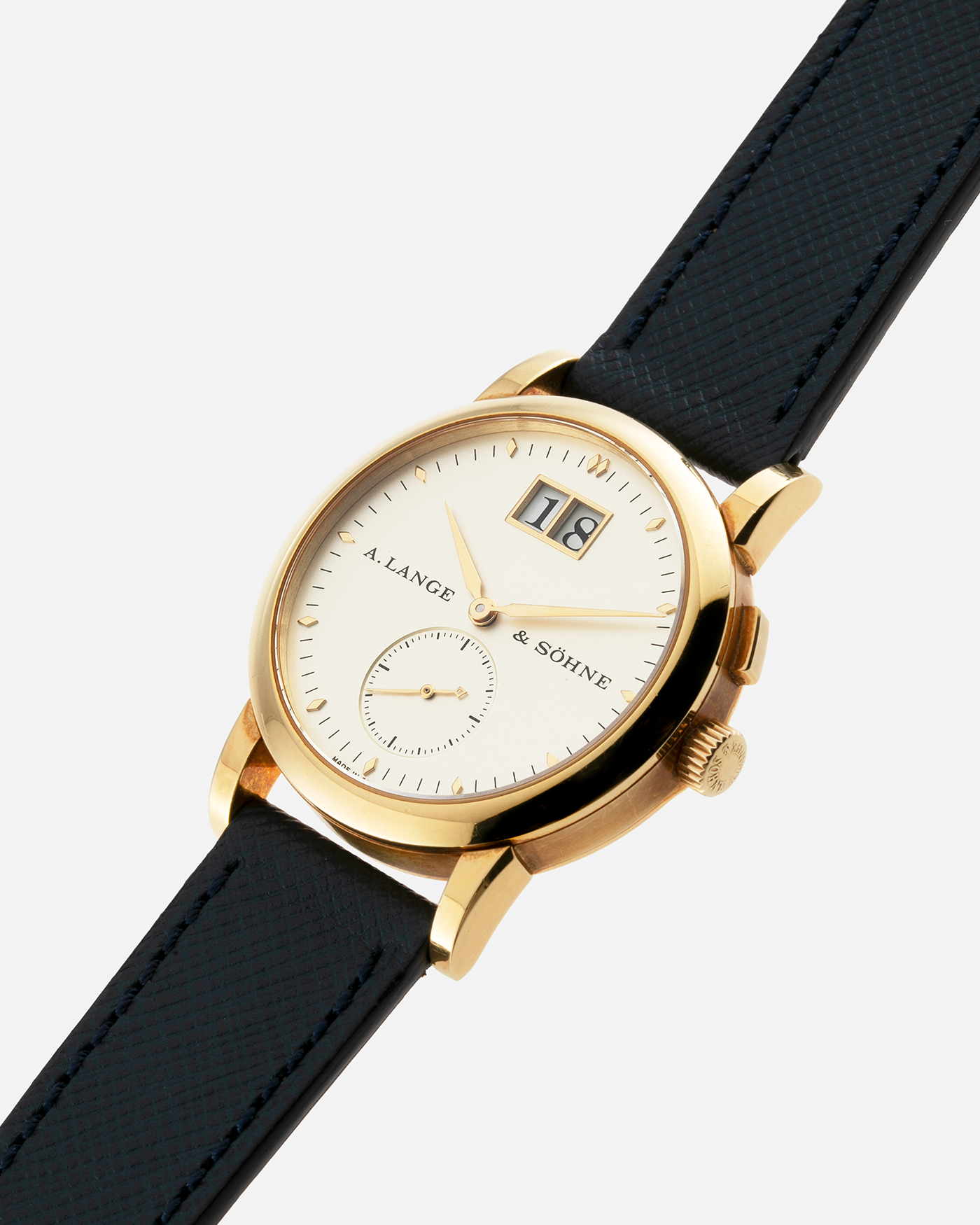 Brand: A. Lange & Sohne Year: Between 1994 - 1996 Model: Saxonia   Reference Number: 102.011 Material: 18-carat Yellow Gold Movement: Cal. L911.3, Manual-Wind Case Diameter: 34mm x 9.1mm Bracelet/Strap: Navy Blue Molequin Textured Leather and A. Lange & Sohne Black Alligator with Signed 18-carat Yellow Gold Tang Buckle