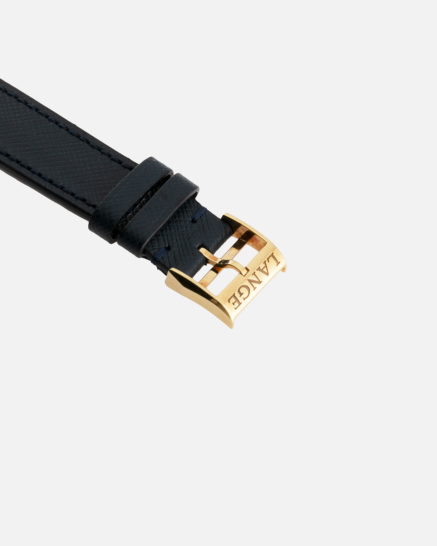 Brand: A. Lange & Sohne Year: Between 1994 - 1996 Model: Saxonia   Reference Number: 102.011 Material: 18-carat Yellow Gold Movement: Cal. L911.3, Manual-Wind Case Diameter: 34mm x 9.1mm Bracelet/Strap: Navy Blue Molequin Textured Leather and A. Lange & Sohne Black Alligator with Signed 18-carat Yellow Gold Tang Buckle
