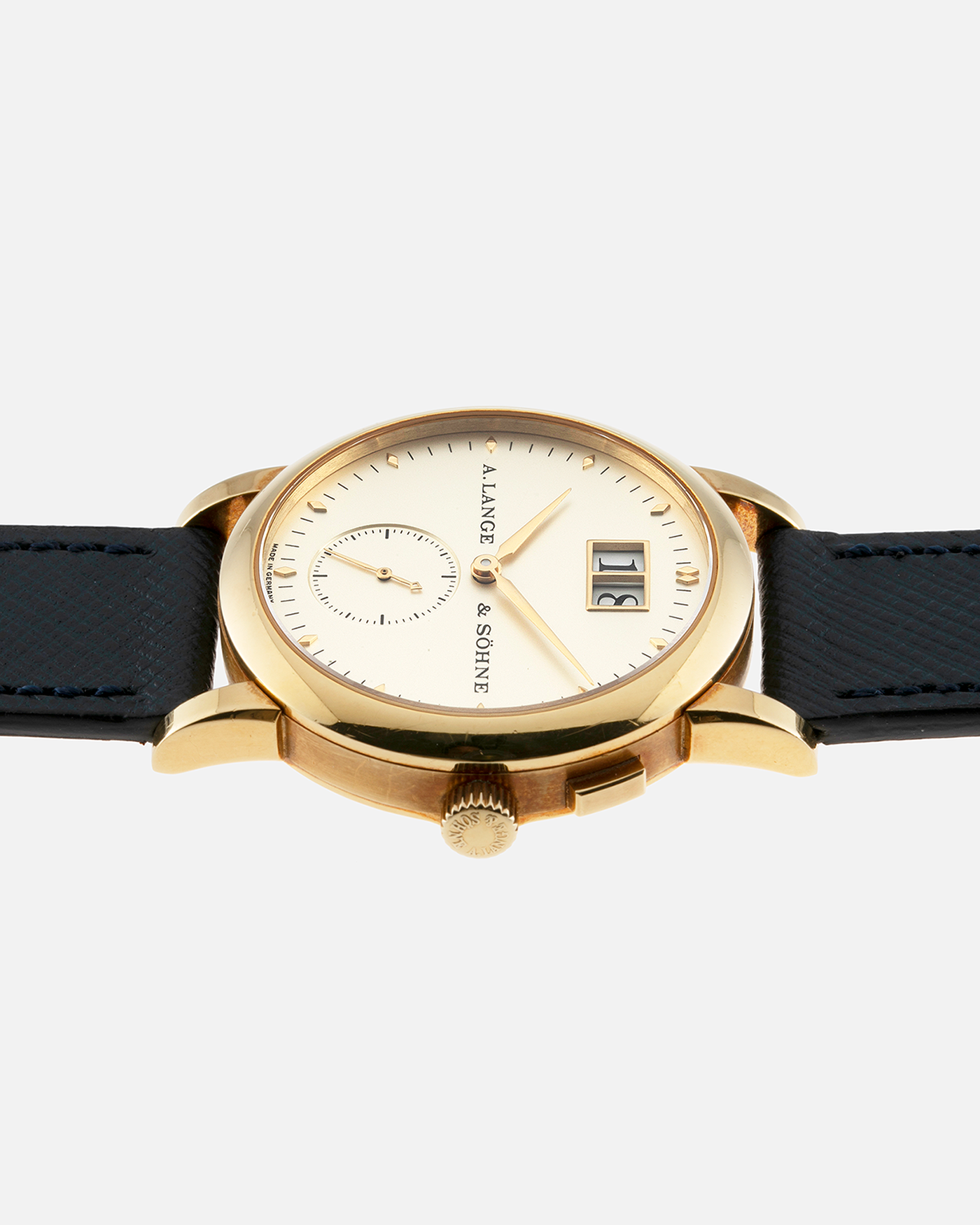 Brand: A. Lange & Sohne Year: Between 1994 - 1996 Model: Saxonia   Reference Number: 102.011 Material: 18-carat Yellow Gold Movement: Cal. L911.3, Manual-Wind Case Diameter: 34mm x 9.1mm Bracelet/Strap: Navy Blue Molequin Textured Leather and A. Lange & Sohne Black Alligator with Signed 18-carat Yellow Gold Tang Buckle
