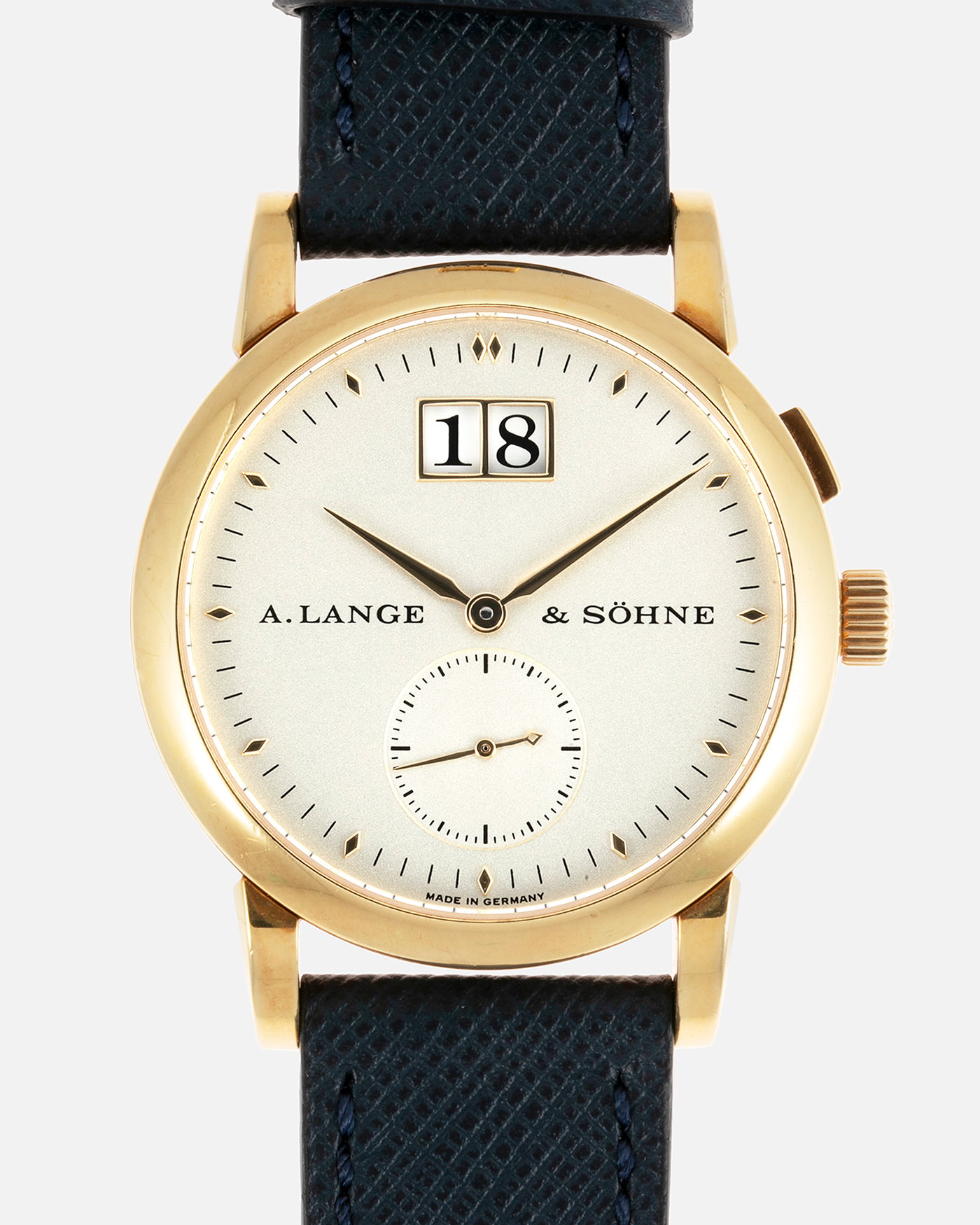 Brand: A. Lange & Sohne Year: Between 1994 - 1996 Model: Saxonia   Reference Number: 102.011 Material: 18-carat Yellow Gold Movement: Cal. L911.3, Manual-Wind Case Diameter: 34mm x 9.1mm Bracelet/Strap: Navy Blue Molequin Textured Leather and A. Lange & Sohne Black Alligator with Signed 18-carat Yellow Gold Tang Buckle