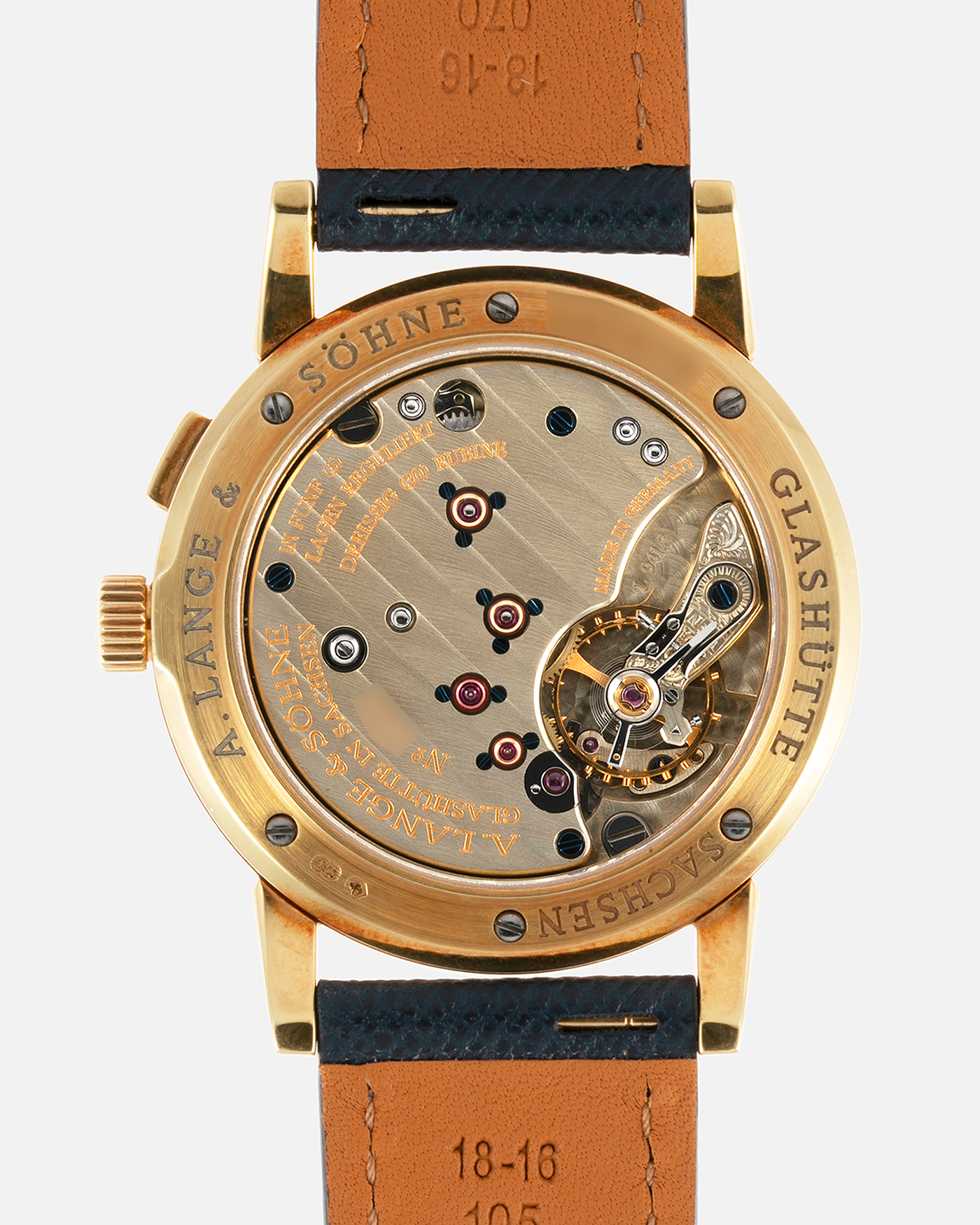 Brand: A. Lange & Sohne Year: Between 1994 - 1996 Model: Saxonia   Reference Number: 102.011 Material: 18-carat Yellow Gold Movement: Cal. L911.3, Manual-Wind Case Diameter: 34mm x 9.1mm Bracelet/Strap: Navy Blue Molequin Textured Leather and A. Lange & Sohne Black Alligator with Signed 18-carat Yellow Gold Tang Buckle