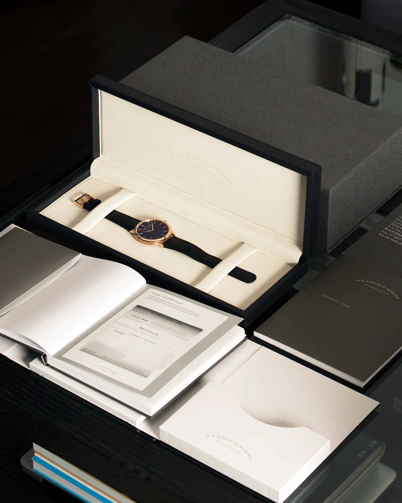 Brand: A. Lange & Sohne Year: 2021 Model: Saxonia Thin Adventurine Ref Number: 211.088 Material: 18k Rose Gold Movement: Manual Winding In-House Cal. L093.1 Case Diameter: 38mm Bracelet/Strap: A. Lange & Sohne Dark Blue Alligator Strap with signed 18k Rose Gold Tang Buckle
