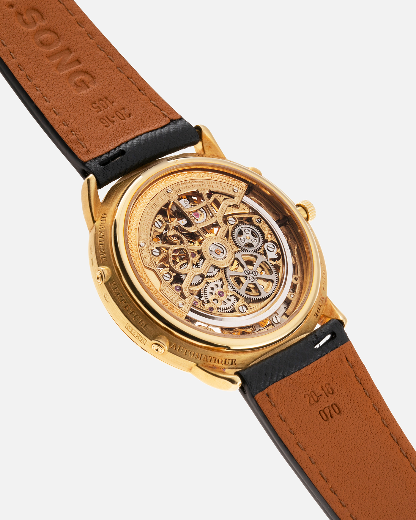 Brand: Audemars Piguet Year: 1980’s Model: Quantieme Perpetual Calendar Openworked Reference Number: 25668BA Material: 18k Yellow Gold Movement: Cal. 2120/2800 Case Diameter: 39mm Bracelet: Molequin Navy Blue Textured Calf and 18k Yellow Gold Audemars Piguet Tang Buckle with additional Audemars Piguet Purple Crocodile Strap