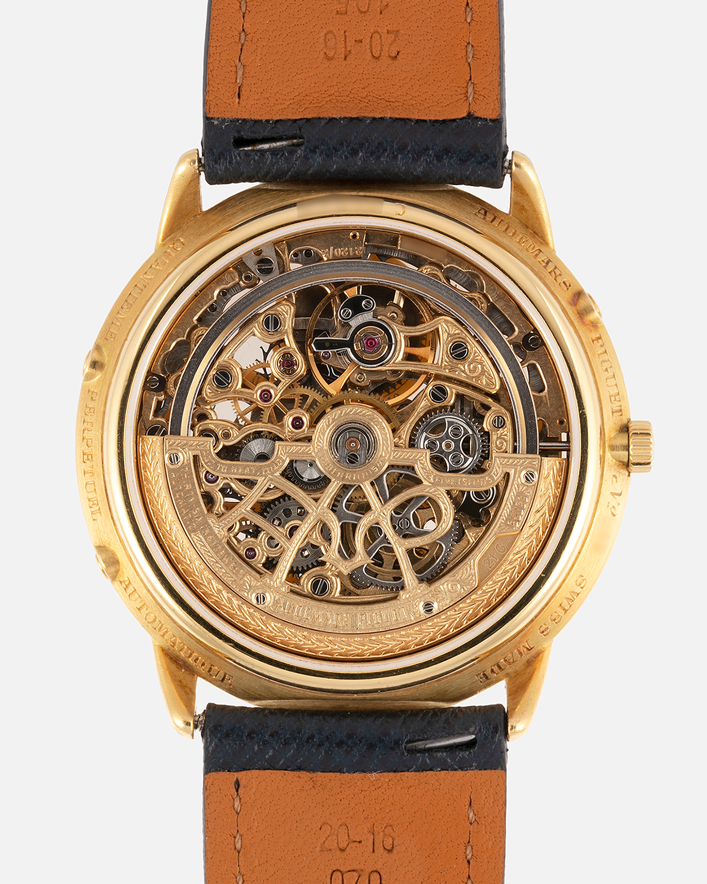 Brand: Audemars Piguet Year: 1980’s Model: Quantieme Perpetual Calendar Openworked Reference Number: 25668BA Material: 18k Yellow Gold Movement: Cal. 2120/2800 Case Diameter: 39mm Bracelet: Molequin Navy Blue Textured Calf and 18k Yellow Gold Audemars Piguet Tang Buckle with additional Audemars Piguet Purple Crocodile Strap