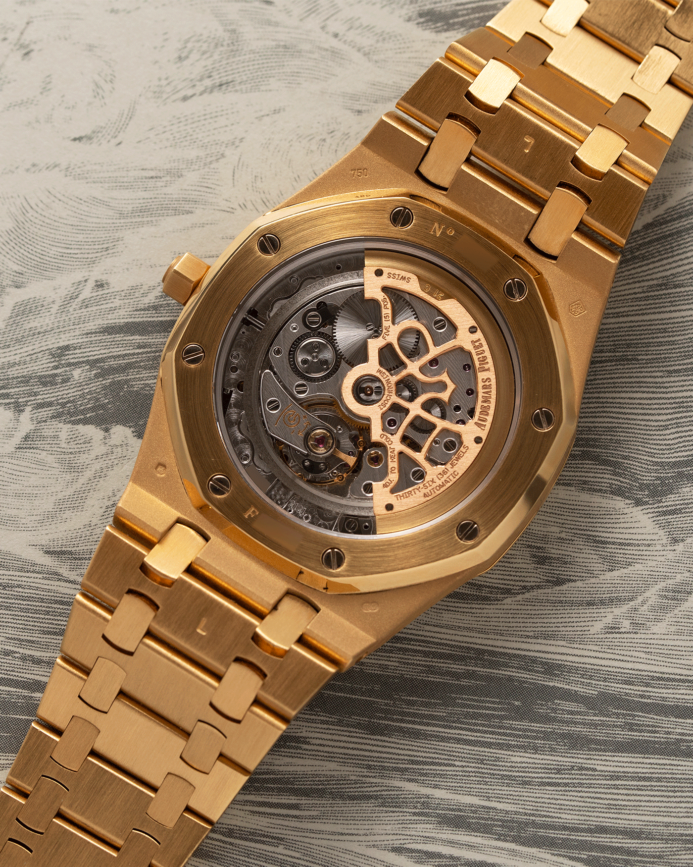 Brand: Audemars Piguet Year: 2006 Model: Royal Oak Reference Number: 15202BA Material: 18k Yellow Gold Movement: Cal 2121 Case Diameter: 39mm Bracelet: Audemars Piguet Integrated 18k Yellow Gold Bracelet