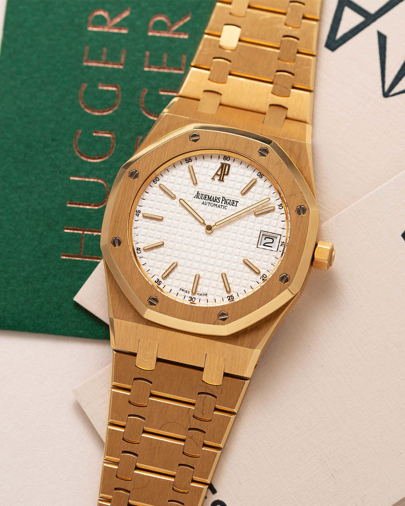 Brand: Audemars Piguet Year: 2006 Model: Royal Oak Reference Number: 15202BA Material: 18k Yellow Gold Movement: Cal 2121 Case Diameter: 39mm Bracelet: Audemars Piguet Integrated 18k Yellow Gold Bracelet