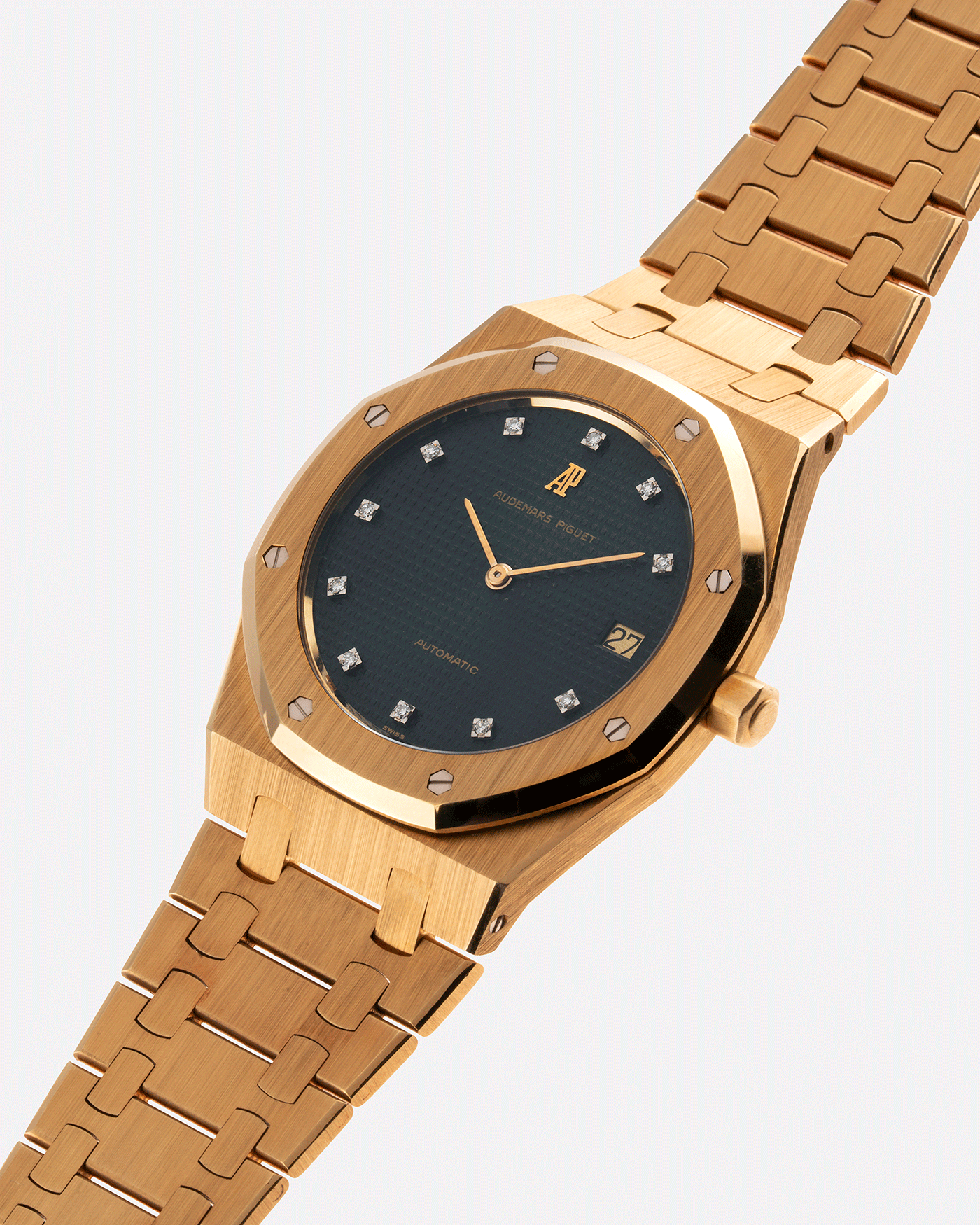 Brand: Audemars Piguet Year: 1980’s Model: Royal Oak Reference Number: 5402BA Material: 18k Yellow Gold Movement: Cal 2121 Case Diameter: 39mm Bracelet: Audemars Piguet Integrated 18k Yellow Gold Bracelet