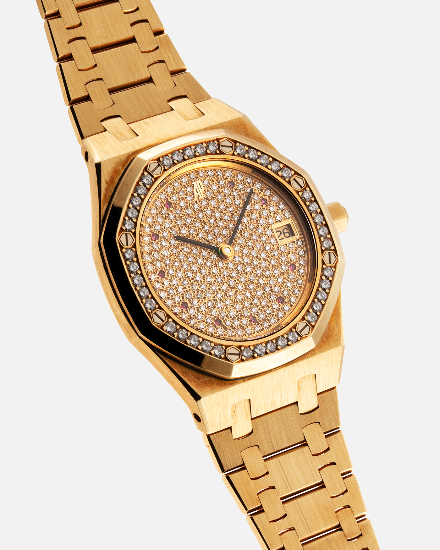 Brand: Audemars Piguet Year: 1990’s Model: Royal Oak “Rubies” Reference Number: 14813BA Material: 18-carat Yellow Gold with Diamond Dial and Bezel Movement: Cal. 2225, Self-Winding Case Diameter: 36mm Strap: Audemars Piguet Integrated 18-carat Yellow Gold Bracelet