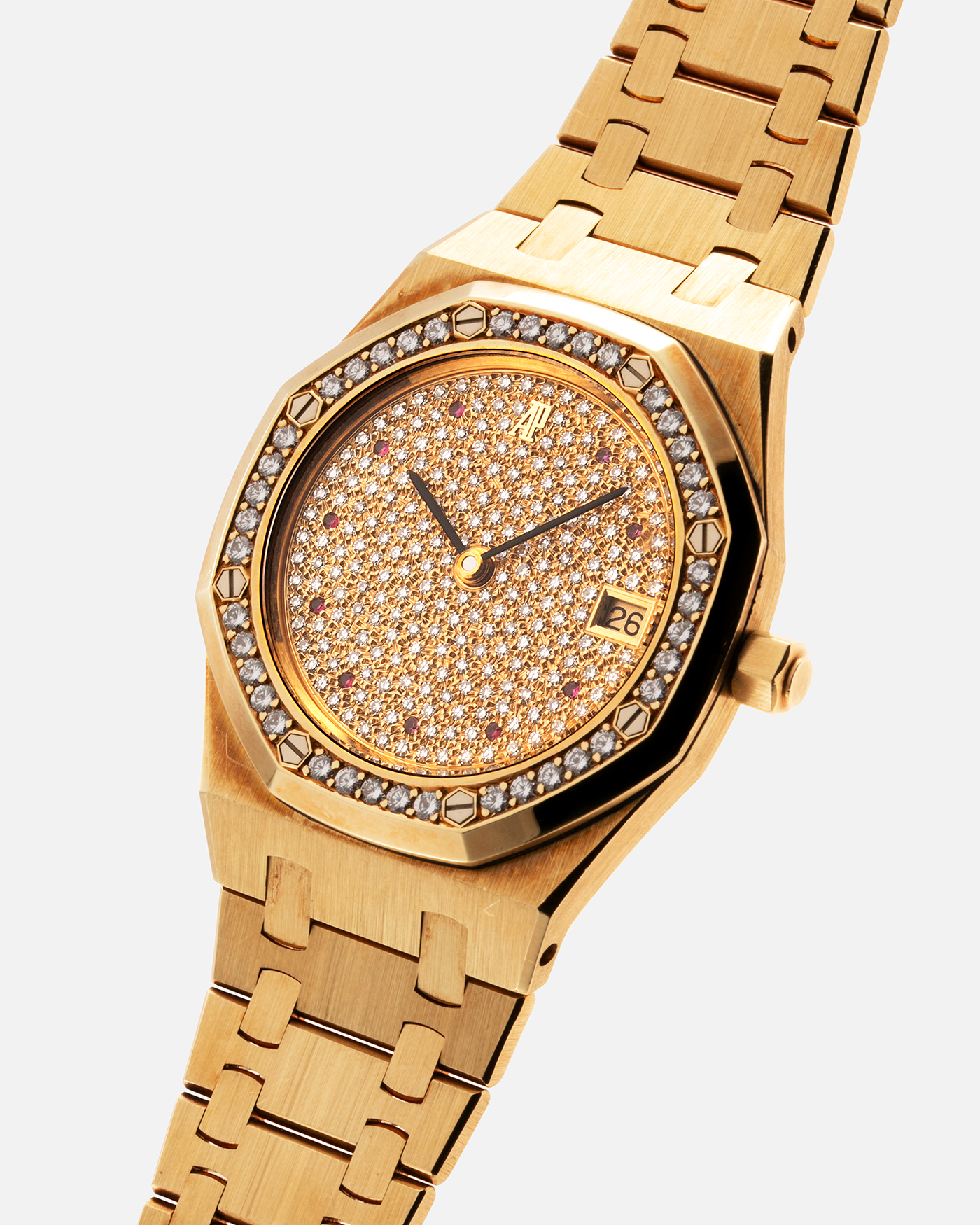 Brand: Audemars Piguet Year: 1990’s Model: Royal Oak “Rubies” Reference Number: 14813BA Material: 18-carat Yellow Gold with Diamond Dial and Bezel Movement: Cal. 2225, Self-Winding Case Diameter: 36mm Strap: Audemars Piguet Integrated 18-carat Yellow Gold Bracelet
