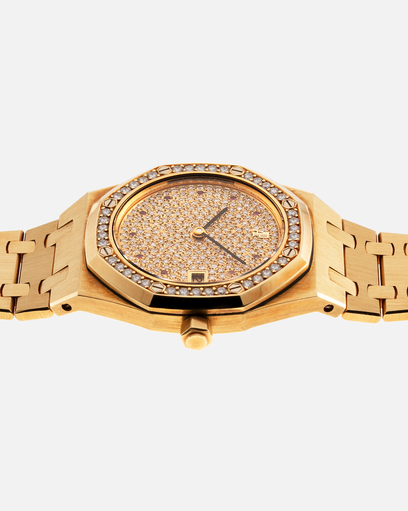 Brand: Audemars Piguet Year: 1990’s Model: Royal Oak “Rubies” Reference Number: 14813BA Material: 18-carat Yellow Gold with Diamond Dial and Bezel Movement: Cal. 2225, Self-Winding Case Diameter: 36mm Strap: Audemars Piguet Integrated 18-carat Yellow Gold Bracelet