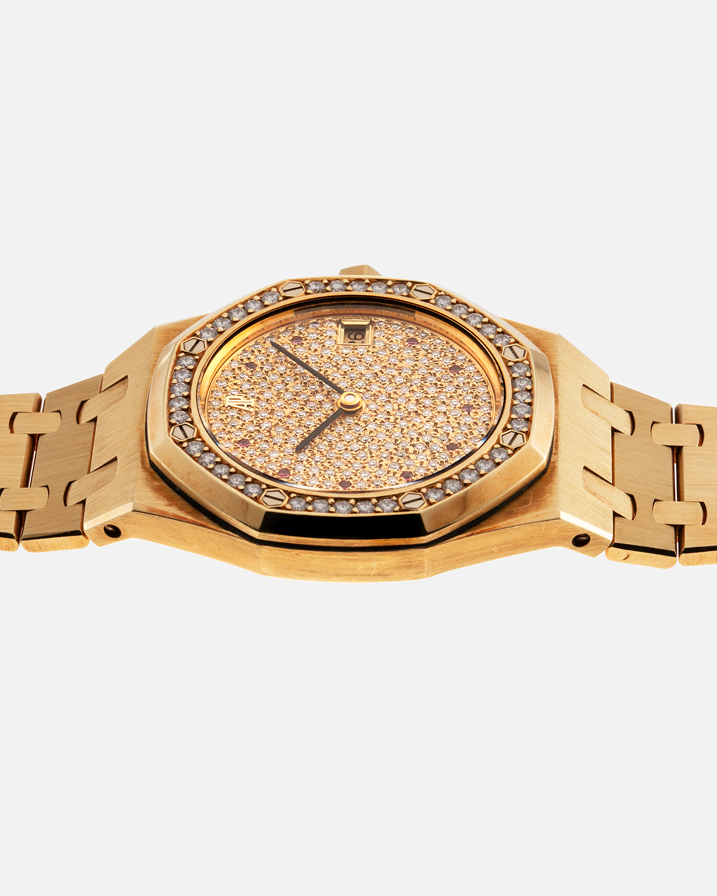 Brand: Audemars Piguet Year: 1990’s Model: Royal Oak “Rubies” Reference Number: 14813BA Material: 18-carat Yellow Gold with Diamond Dial and Bezel Movement: Cal. 2225, Self-Winding Case Diameter: 36mm Strap: Audemars Piguet Integrated 18-carat Yellow Gold Bracelet