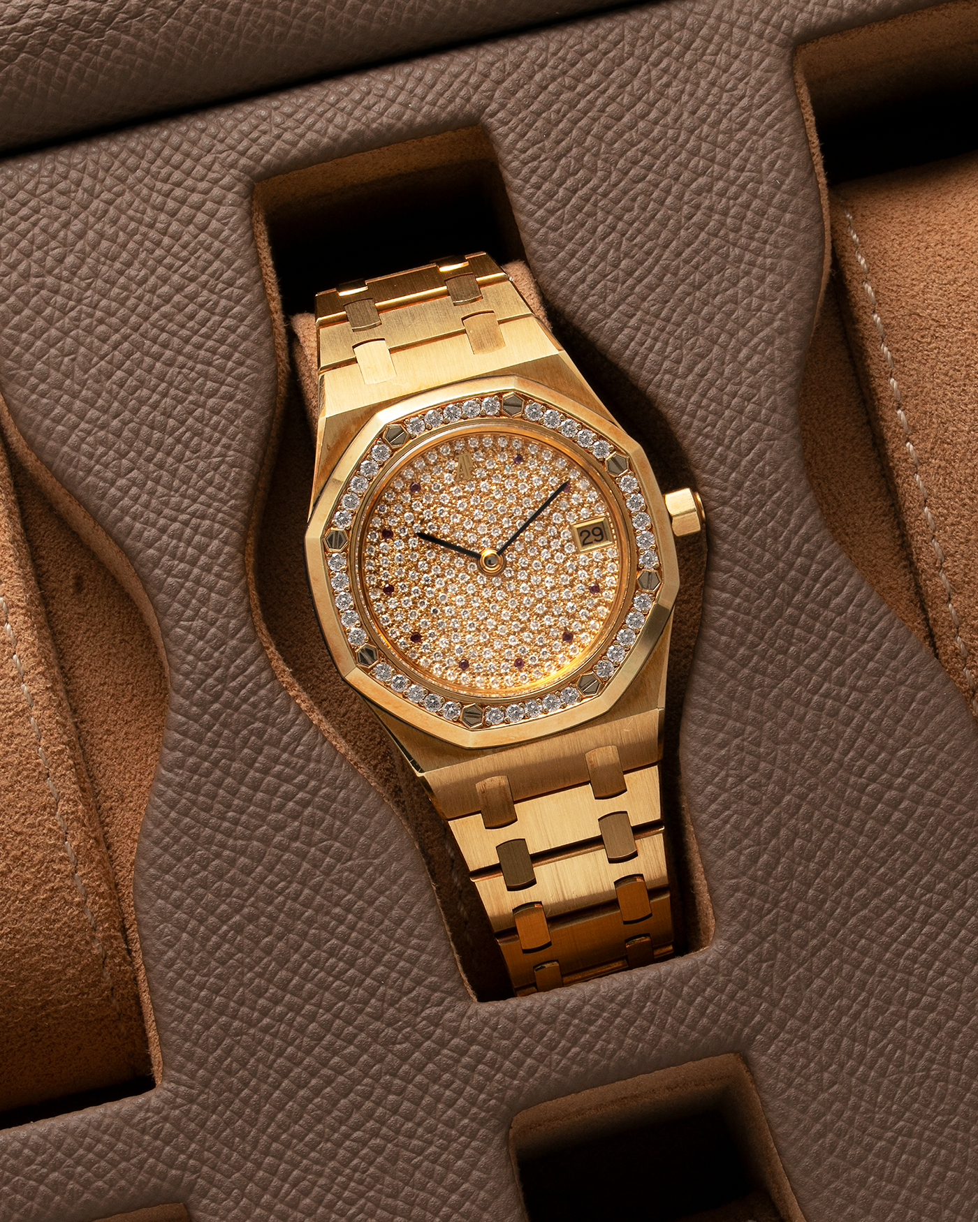 Brand: Audemars Piguet Year: 1990’s Model: Royal Oak “Rubies” Reference Number: 14813BA Material: 18-carat Yellow Gold with Diamond Dial and Bezel Movement: Cal. 2225, Self-Winding Case Diameter: 36mm Strap: Audemars Piguet Integrated 18-carat Yellow Gold Bracelet