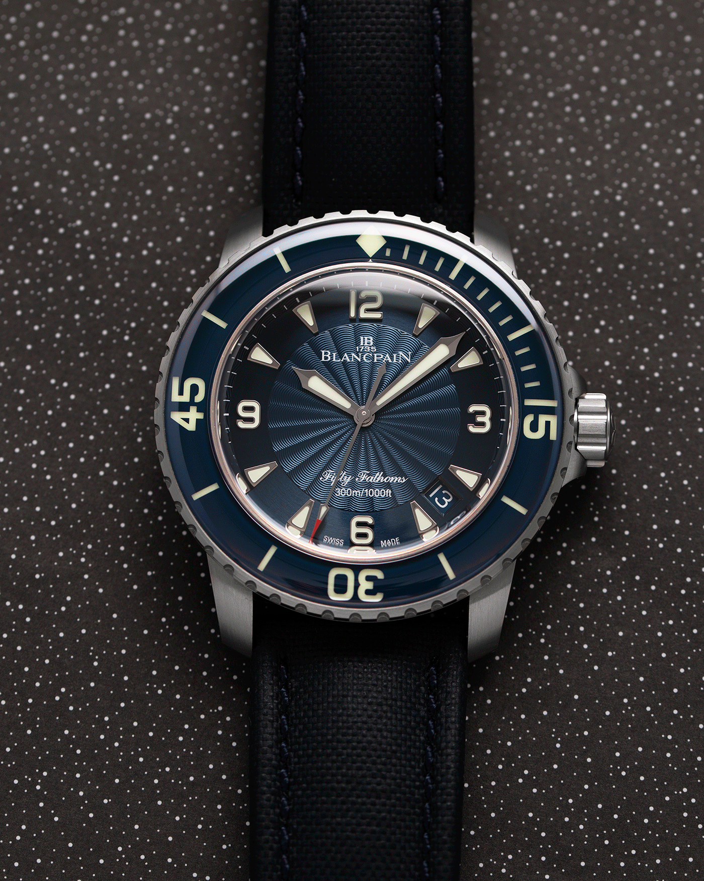 Brand: Blancpain Year: 2015 Model: Fifty Fathoms Reference Number: 5015D-1140-52B  Material: Stainless Steel Movement: Cal. 1315 Case Diameter: 45mm Bracelet/Strap: Blancpain Blue Rubberised Sailcloth Strap