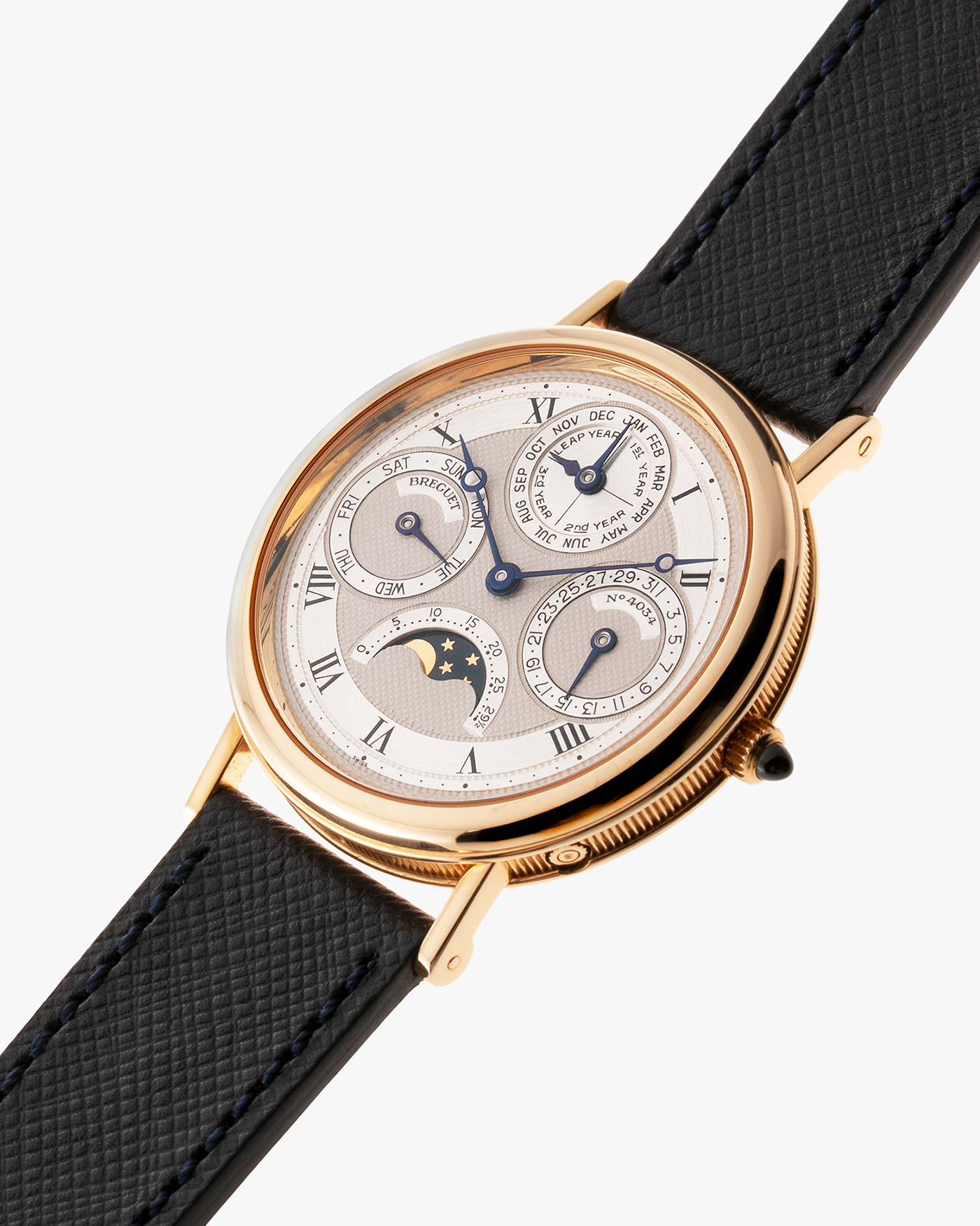 Brand: Breguet Year: 1990’s Model: 3050 Perpetual Calendar Material: 18k Yellow Gold Movement: Breguet Self Winding Perpetual Calendar Case Diameter: 36mm Strap: Molequin Navy Blue Textured Calf with 18k Yellow Gold Breguet Tang Buckle