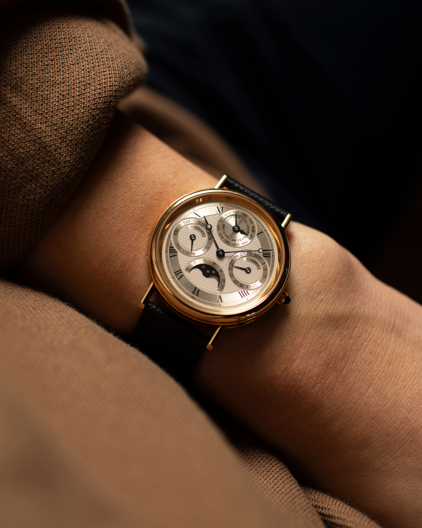 Brand: Breguet Year: 1990’s Model: 3050 Perpetual Calendar Material: 18k Yellow Gold Movement: Breguet Self Winding Perpetual Calendar Case Diameter: 36mm Strap: Molequin Navy Blue Textured Calf with 18k Yellow Gold Breguet Tang Buckle