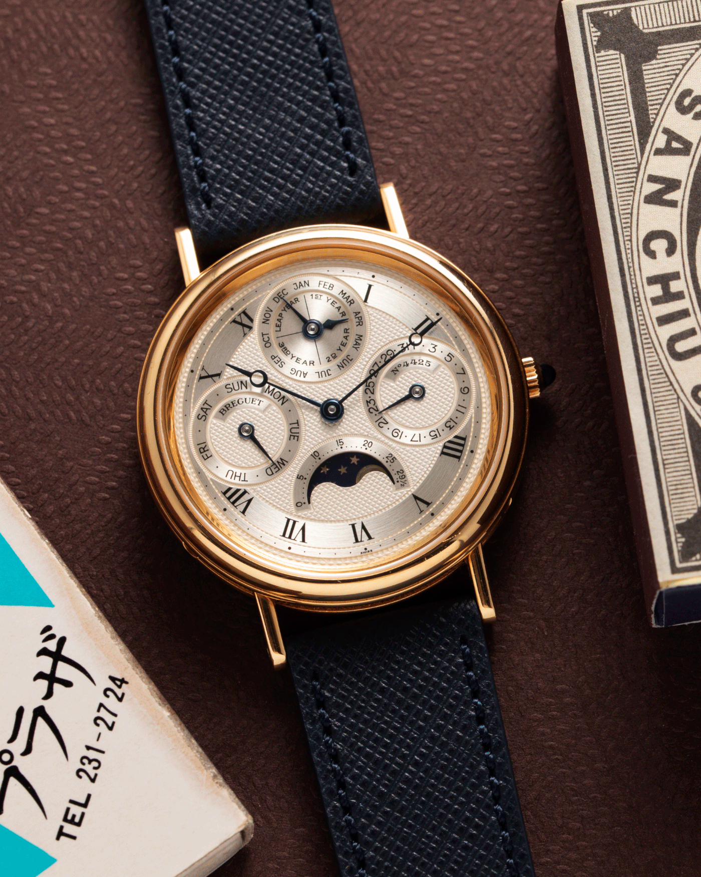 Brand: Breguet Year: 1990’s Model: 3050 Perpetual Calendar Material: 18k Yellow Gold Movement: Breguet Self Winding Perpetual Calendar Case Diameter: 36mm Strap: Molequin Navy Blue Textured Calf with 18k Yellow Gold Breguet Tang Buckle