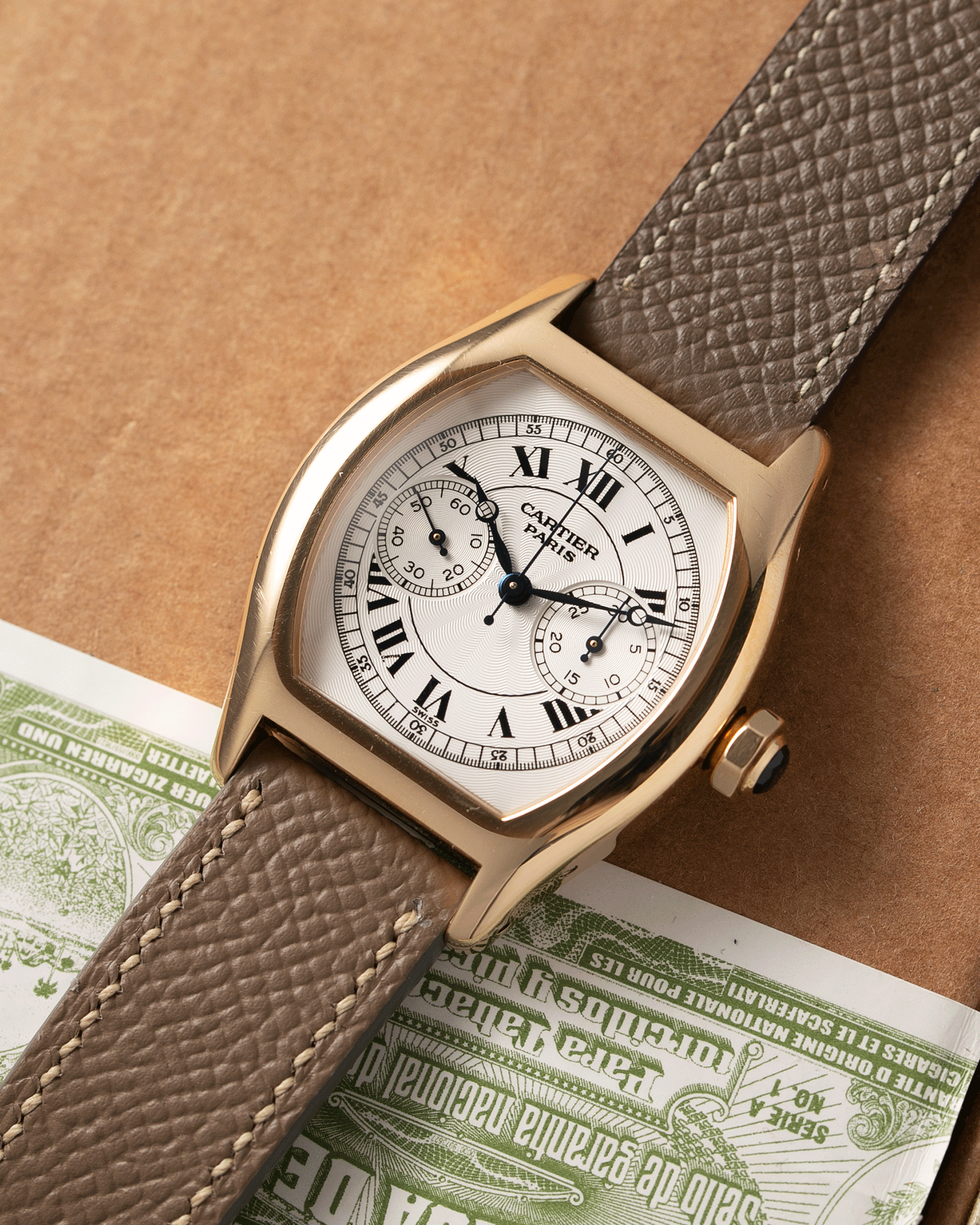 Brand: Cartier Year: 2000’s Model: CPCP Collection Prive Tortue Monopoussoir Reference: 2356E Material: 18k Yellow Gold Movement: THA Cal. 045MC Case Diameter: 43 x 35 mm Strap: Cartier Nostime Taupe Grained Calf with 18k Cartier Yellow Gold Deployant F.P. Journe