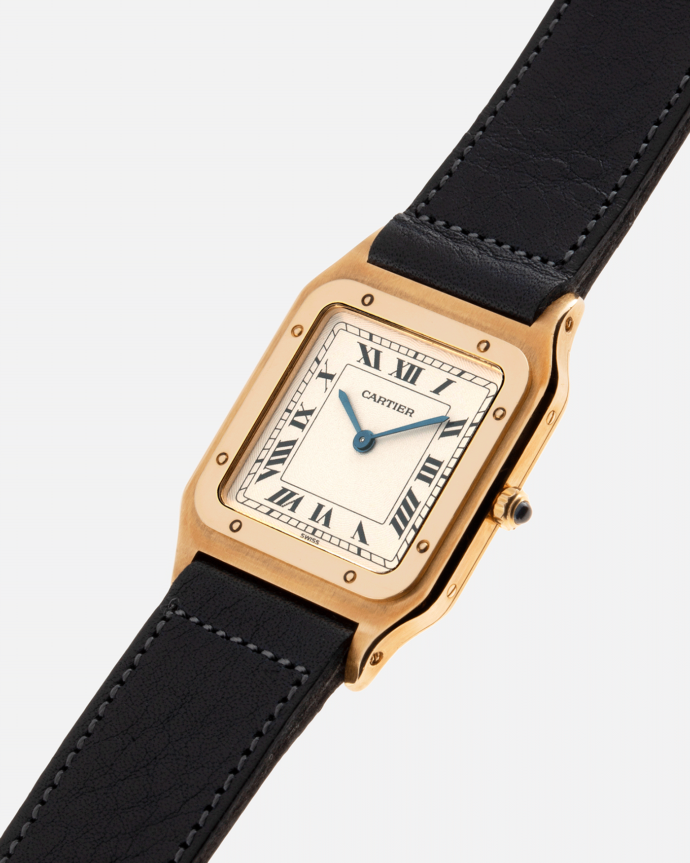 Brand: Cartier Year: 1990s Model: Santos Dumont Reference: 1576 Material: 18k Yellow Gold Movement: F.Piguet 21 Case Diameter: 27mm Strap: Accurate Form Navy Blue Japanese Calf and 18k Yellow Gold Cartier Deployant