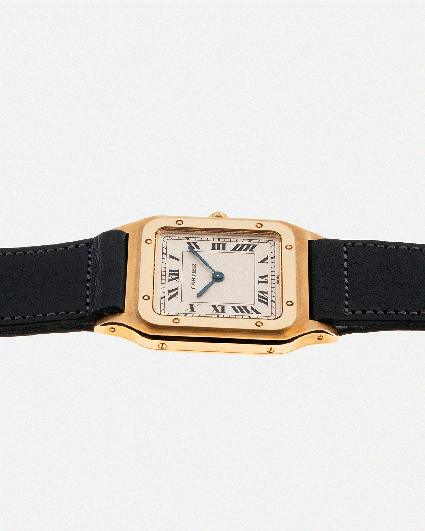 Brand: Cartier Year: 1990s Model: Santos Dumont Reference: 1576 Material: 18k Yellow Gold Movement: F.Piguet 21 Case Diameter: 27mm Strap: Accurate Form Navy Blue Japanese Calf and 18k Yellow Gold Cartier Deployant
