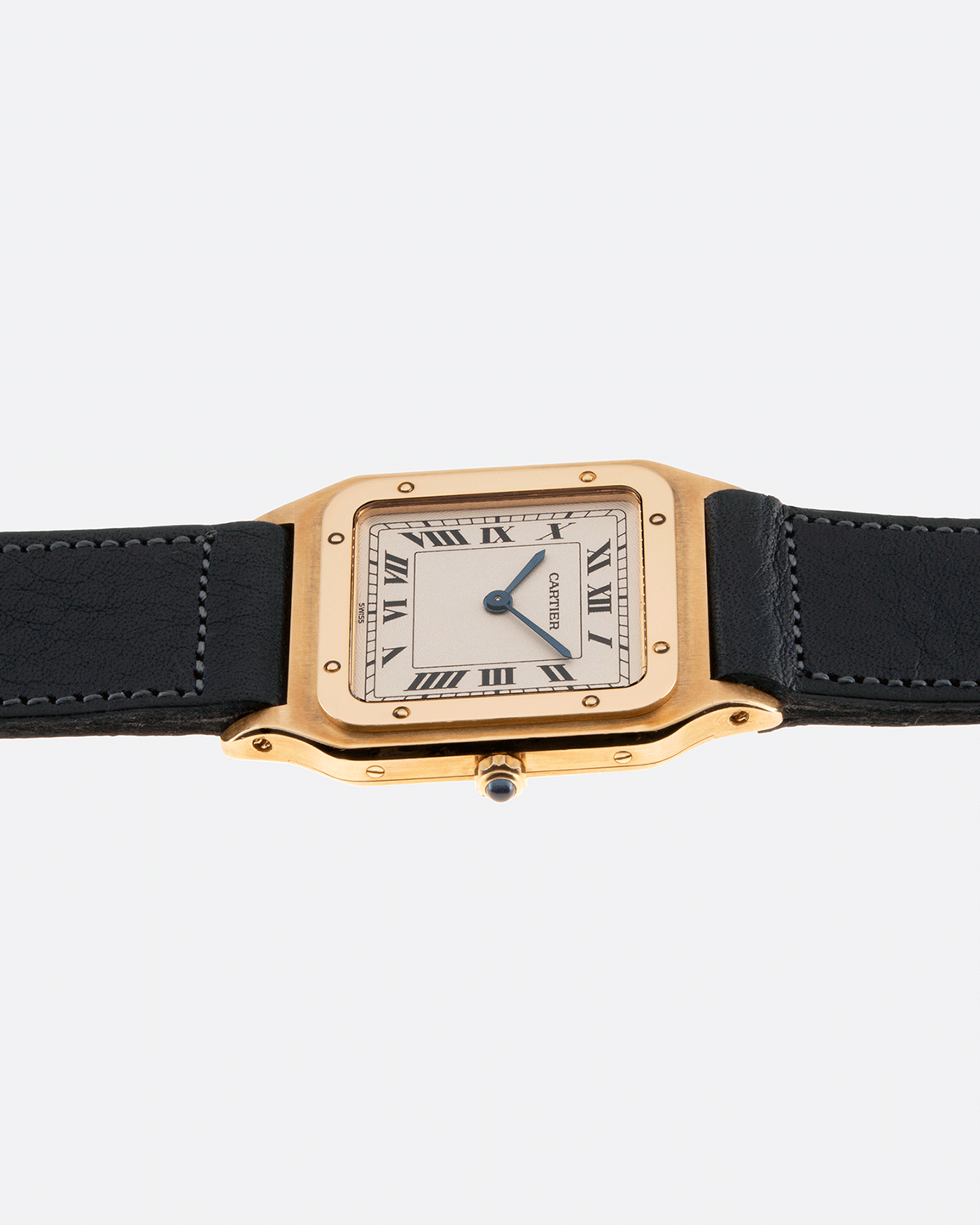 Brand: Cartier Year: 1990s Model: Santos Dumont Reference: 1576 Material: 18k Yellow Gold Movement: F.Piguet 21 Case Diameter: 27mm Strap: Accurate Form Navy Blue Japanese Calf and 18k Yellow Gold Cartier Deployant