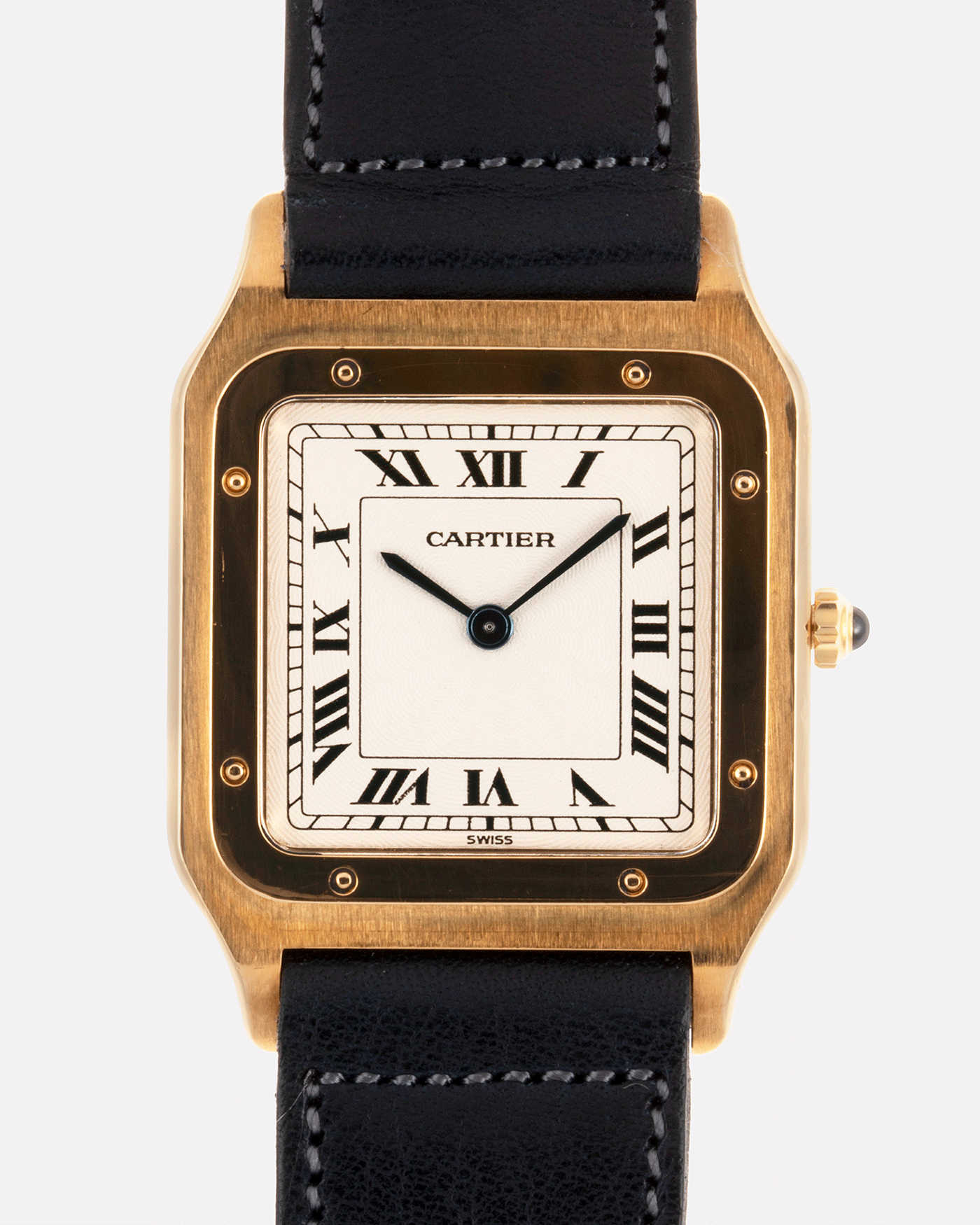 Brand: Cartier Year: 1990s Model: Santos Dumont Reference: 1576 Material: 18k Yellow Gold Movement: F.Piguet 21 Case Diameter: 27mm Strap: Accurate Form Navy Blue Japanese Calf and 18k Yellow Gold Cartier Deployant