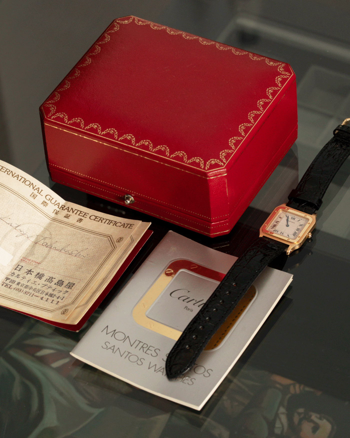 Brand: Cartier Year: 1990s Model: Santos Dumont Reference: 1576 Material: 18k Yellow Gold Movement: F.Piguet 21 Case Diameter: 27mm Strap: Black Leather Strap with Cartier 18k Yellow Gold Tang Buckle