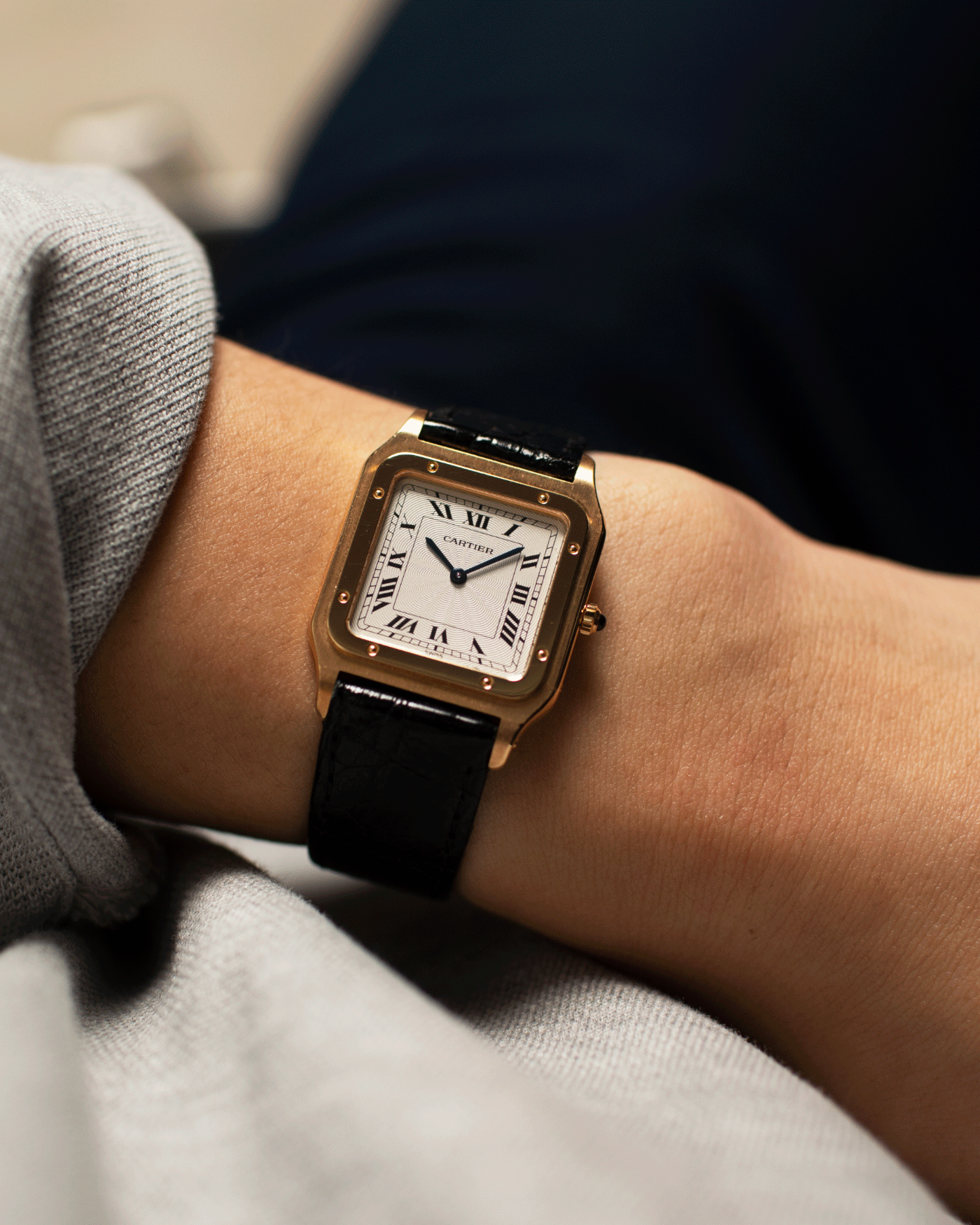 Brand: Cartier Year: 1990s Model: Santos Dumont Reference: 1576 Material: 18k Yellow Gold Movement: F.Piguet 21 Case Diameter: 27mm Strap: Black Leather Strap with Cartier 18k Yellow Gold Tang Buckle