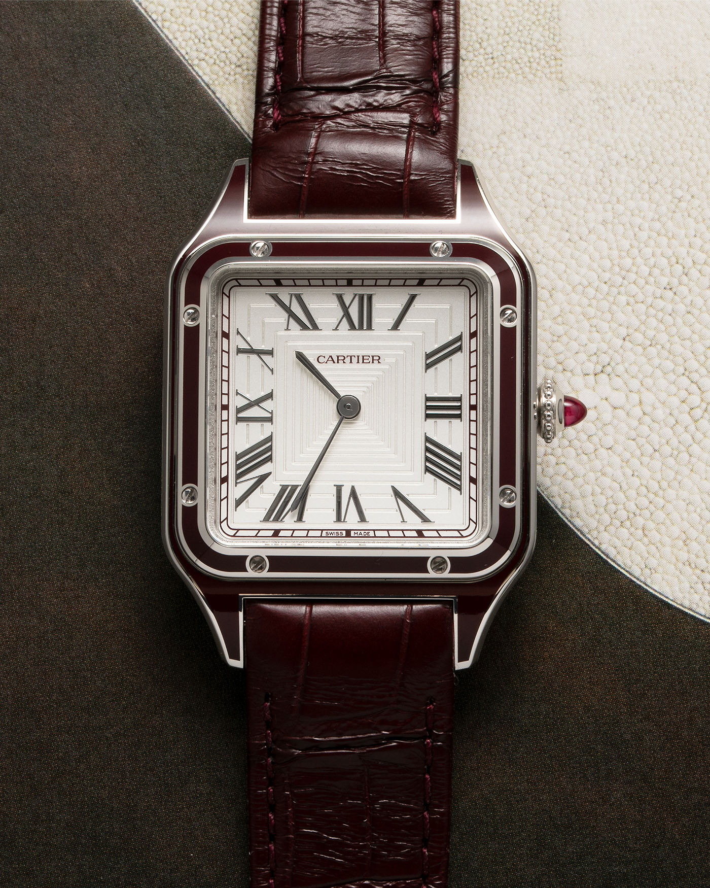 Brand: Cartier Year: 2022 Model: Santos-Dumont Large Limited Edition of 150 pieces Material: Platinum, Burgundy Lacquer Movement: Cartier Cal. 430 MC, Manual-Winding Case Diameter: 43.5mm x 31.4mm Bracelet / Strap: Cartier Burgundy Alligator Leather Strap with Signed Platinum Tang Buckle