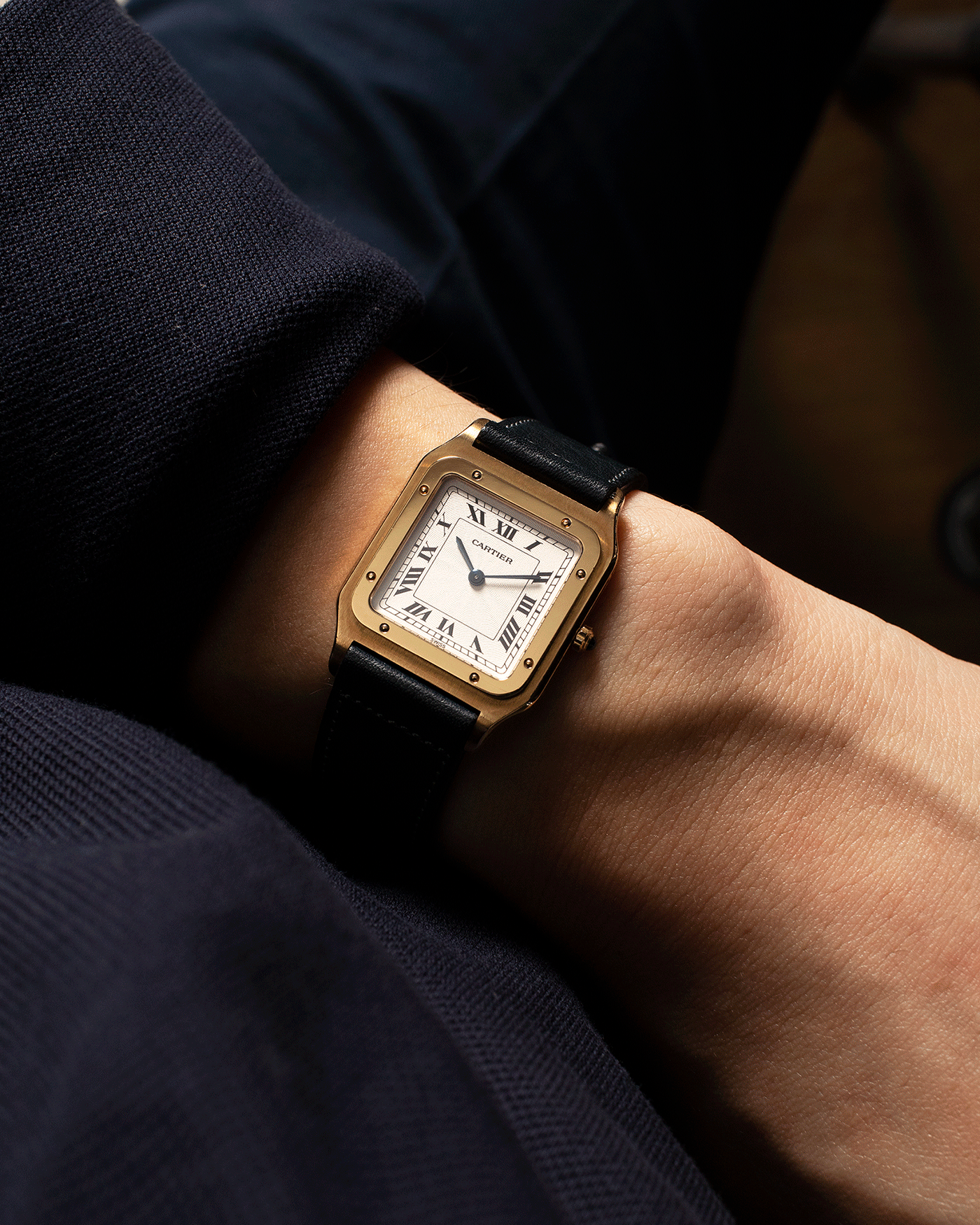 Brand: Cartier Year: 1990s Model: Santos Dumont Reference: 1576 Material: 18k Yellow Gold Movement: F.Piguet 21 Case Diameter: 27mm Strap: Accurate Form Navy Blue Japanese Calf and 18k Yellow Gold Cartier Deployant