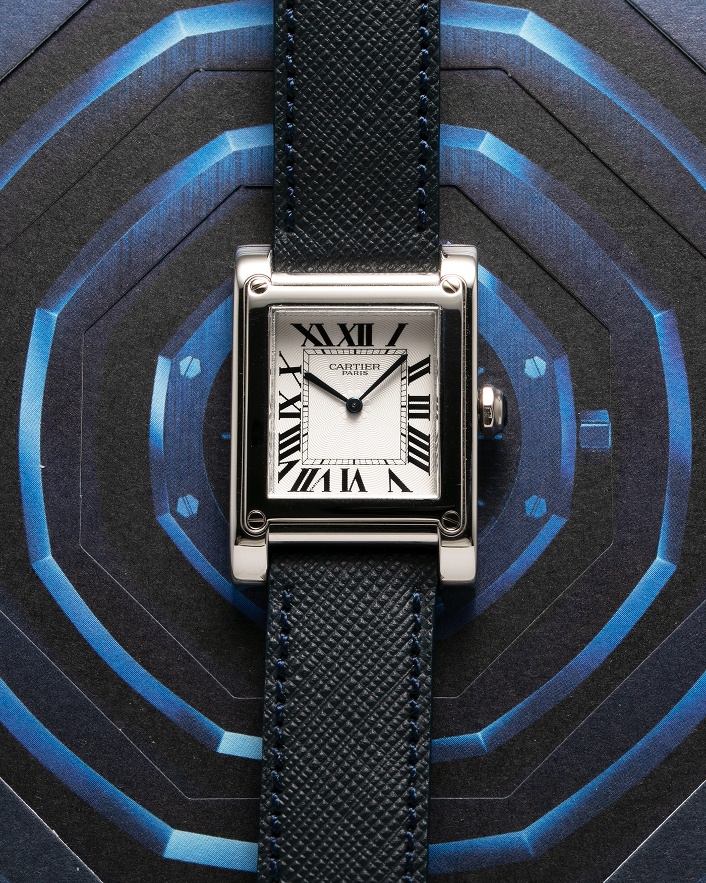 Brand: Cartier Year: 2000’s Model: Tank A Vis Material: Platinum Movement: Cartier 437MC Case Diameter: 26mm X 39mm Strap: Molequin Navy Blue Textured Calf and 18k White Gold Deployant Clasp