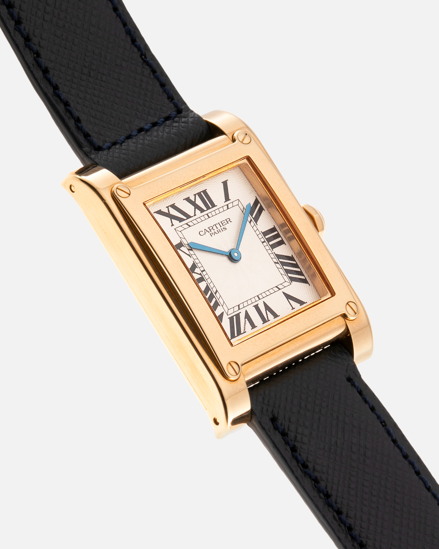 Brand: Cartier Year: 2000’s Model: Tank A Vis Material: 18k Yellow Gold Movement: Cartier 437MC Case Diameter: 26mm X 39mm Strap: Molequin Navy Blue Textured Calf and 18k Yellow Gold Deployant Clasp