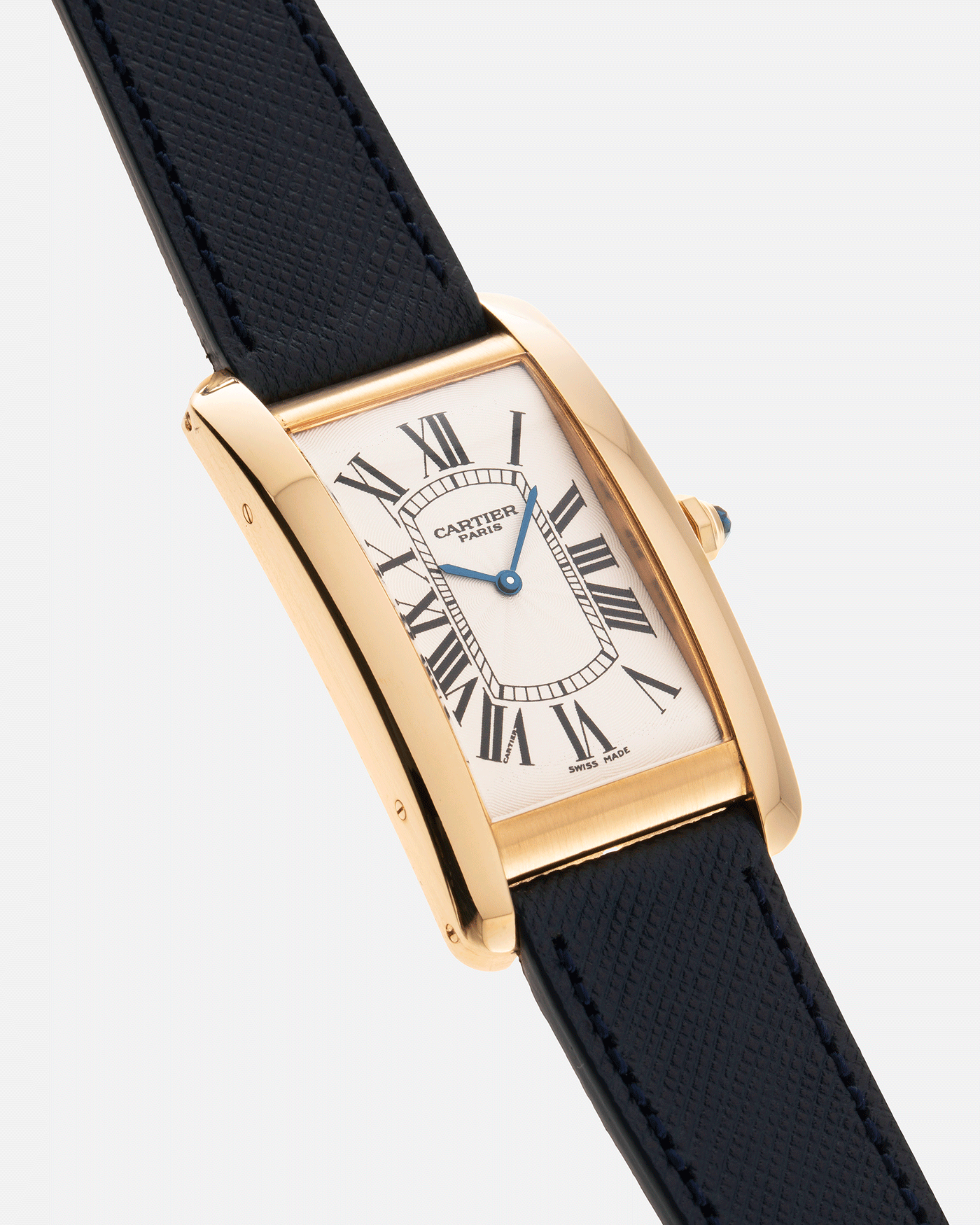 Brand: Cartier Year: 1990s Model: CPCP Collection Prive Tank Americaine Reference: 1735 Material: 18k Yellow Gold Movement: Cartier Caliber 430 MC Case Diameter: 45mm X26mm Strap: Navy Blue Molequin Textured Calf Strap with separate 18k Cartier Yellow Gold Deployant
