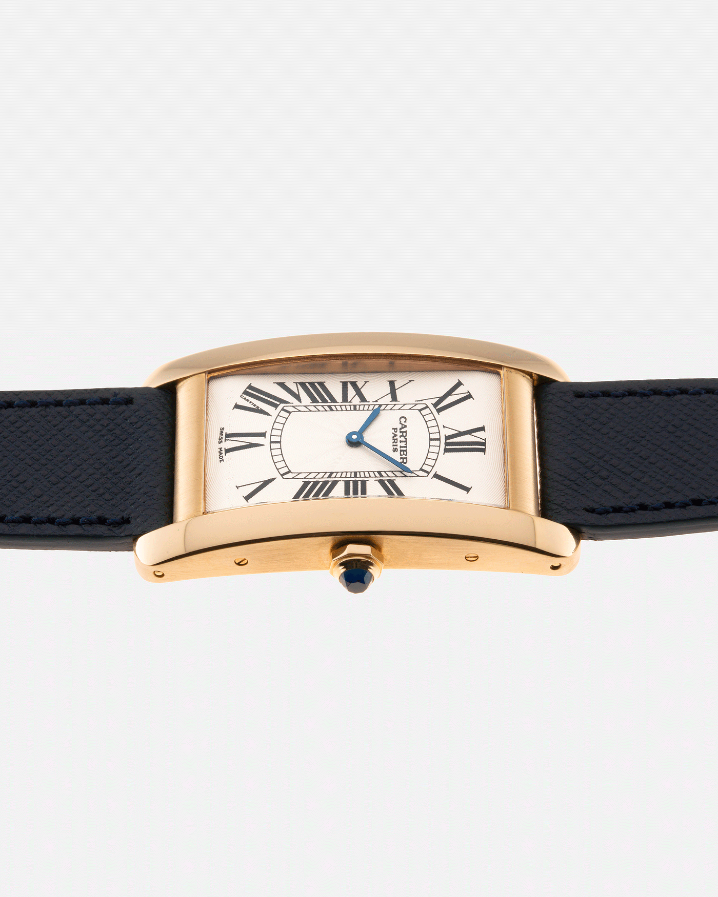 Brand: Cartier Year: 1990s Model: CPCP Collection Prive Tank Americaine Reference: 1735 Material: 18k Yellow Gold Movement: Cartier Caliber 430 MC Case Diameter: 45mm X26mm Strap: Navy Blue Molequin Textured Calf Strap with separate 18k Cartier Yellow Gold Deployant
