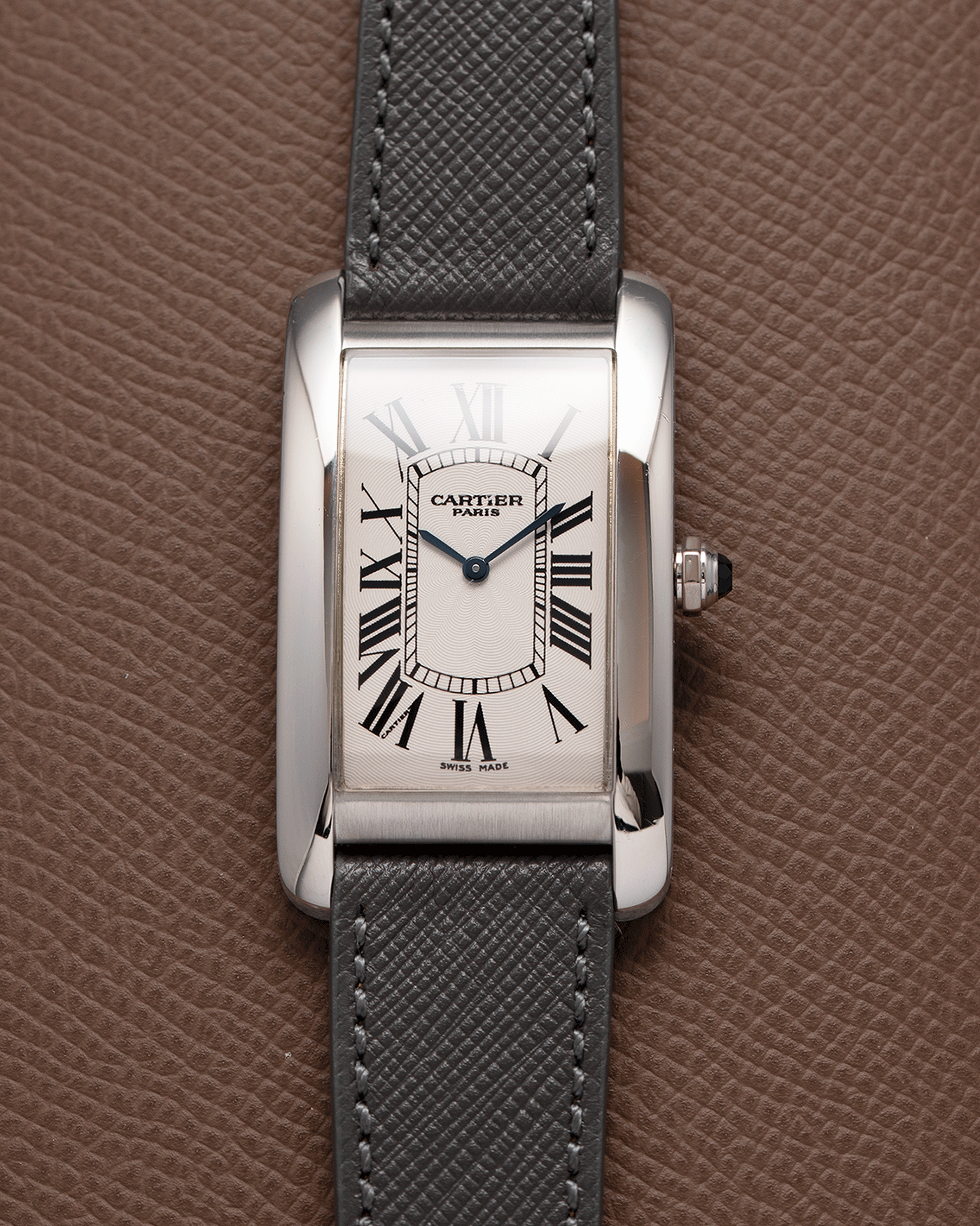 Brand: Cartier Year: 2007 Model: CPCP Collection Prive Tank Americaine Reference: 1734 Material: Platinum Movement: Cartier Caliber 430 MC Case Diameter: 45mm X26mm Strap: Grey Molequin Textured Calf Strap with separate White Gold Cartier Tang Buckle