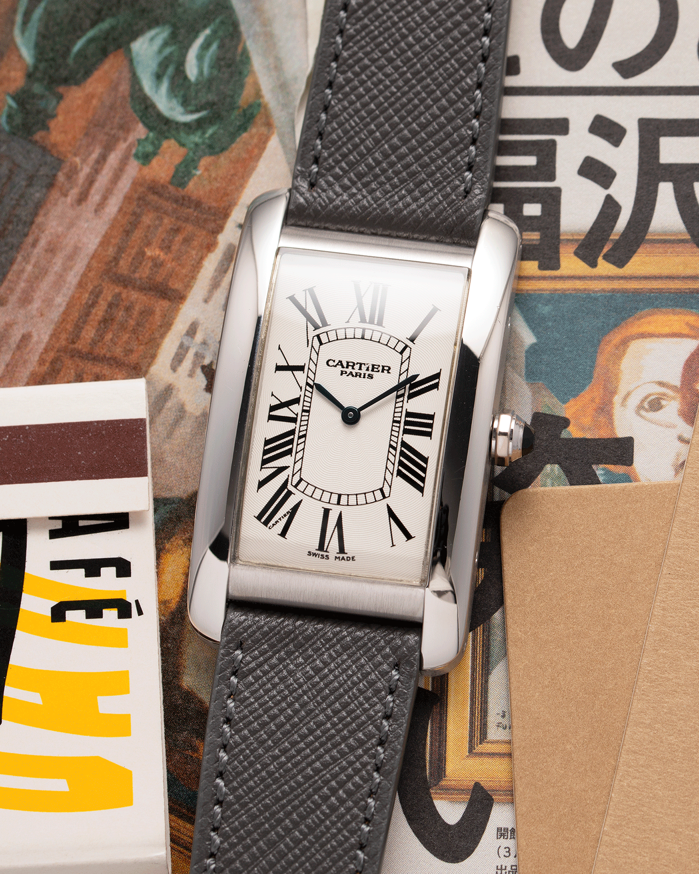 Brand: Cartier Year: 2007 Model: CPCP Collection Prive Tank Americaine Reference: 1734 Material: Platinum Movement: Cartier Caliber 430 MC Case Diameter: 45mm X26mm Strap: Grey Molequin Textured Calf Strap with separate White Gold Cartier Tang Buckle