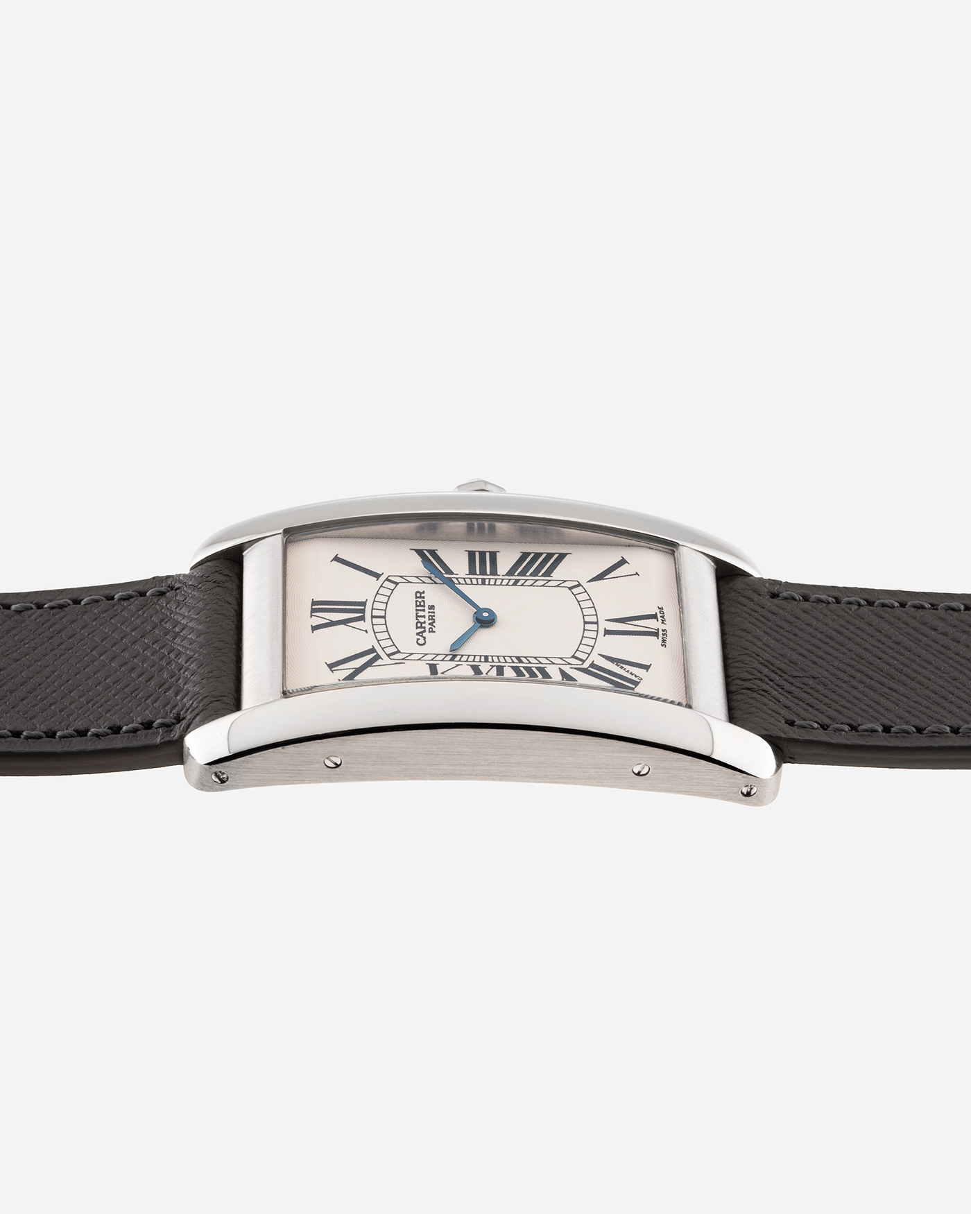Brand: Cartier Year: 2007 Model: CPCP Collection Prive Tank Americaine Reference: 1734 Material: Platinum Movement: Cartier Caliber 430 MC Case Diameter: 45mm X26mm Strap: Grey Molequin Textured Calf Strap with separate White Gold Cartier Tang Buckle