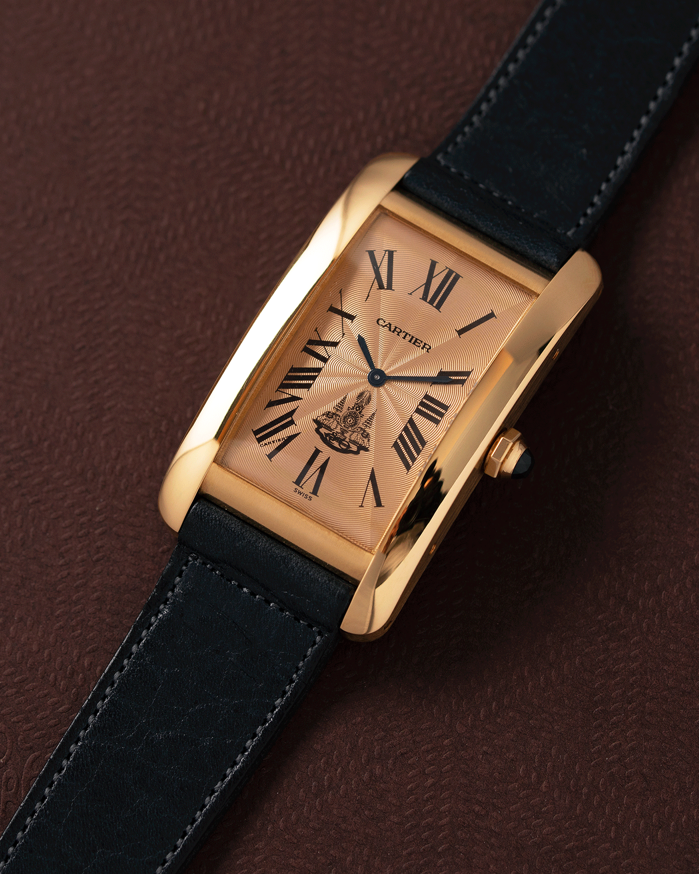 Brand: Cartier Year: 1996 Model: Tank Americaine ‘Thai King’ Reference: 1735 Material: 18k Yellow Gold Movement: Cartier Caliber 430 MC Case Diameter: 45mm X26mm Strap: Navy Blue Accurate Form Calf Strap with separate 18k Cartier Yellow Gold Deployant