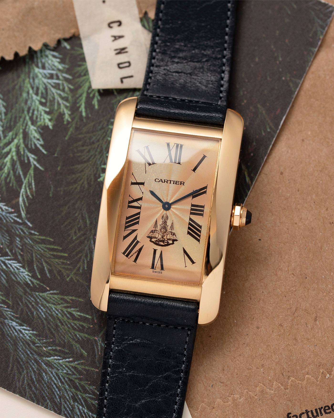 Brand: Cartier Year: 1996 Model: Tank Americaine ‘Thai King’ Reference: 1735 Material: 18k Yellow Gold Movement: Cartier Caliber 430 MC Case Diameter: 45mm X26mm Strap: Navy Blue Accurate Form Calf Strap with separate 18k Cartier Yellow Gold Deployant