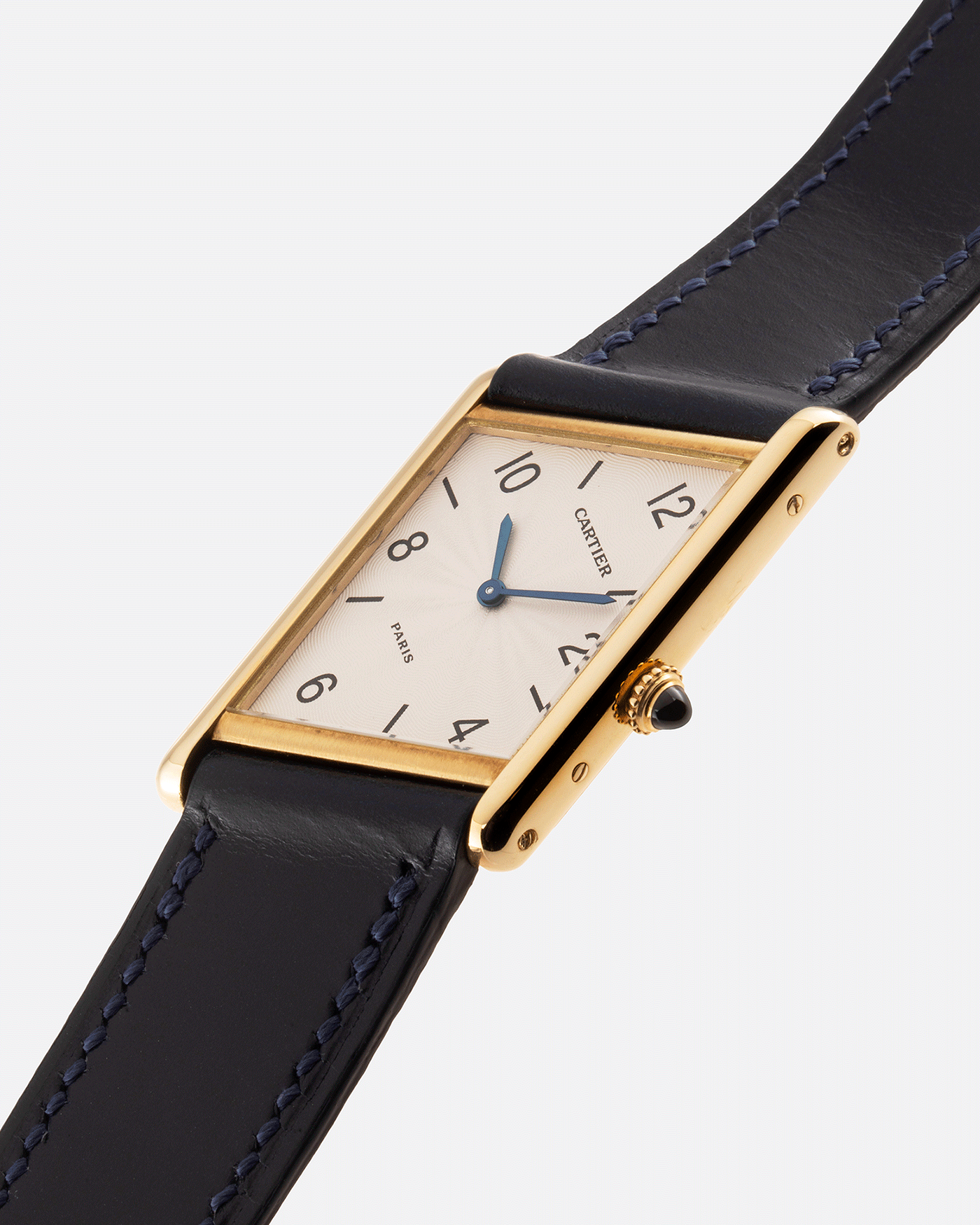 Brand: Cartier Year: 1996 Model: Tank Asymmetrique Limited Reference Number: 2488 Material: 18k Yellow Gold Movement: Cartier Cal. 9P2 Case Diameter: 23mm X 33mm Strap: Nostime Blue Leather with 18k Cartier Yellow Gold Deployant