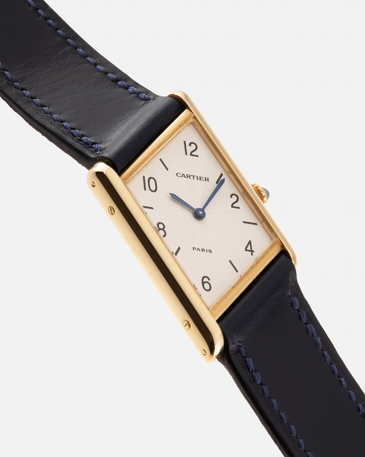 Brand: Cartier Year: 1996 Model: Tank Asymmetrique Limited Reference Number: 2488 Material: 18k Yellow Gold Movement: Cartier Cal. 9P2 Case Diameter: 23mm X 33mm Strap: Nostime Blue Leather with 18k Cartier Yellow Gold Deployant