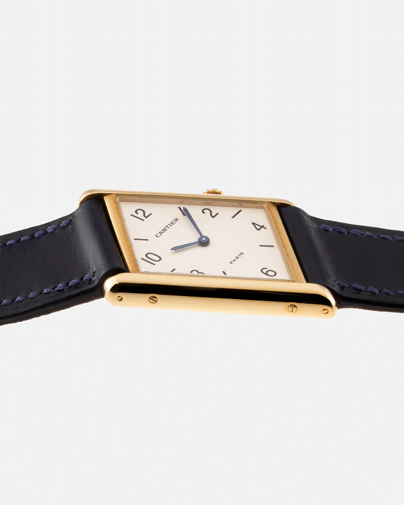 Brand: Cartier Year: 1996 Model: Tank Asymmetrique Limited Reference Number: 2488 Material: 18k Yellow Gold Movement: Cartier Cal. 9P2 Case Diameter: 23mm X 33mm Strap: Nostime Blue Leather with 18k Cartier Yellow Gold Deployant