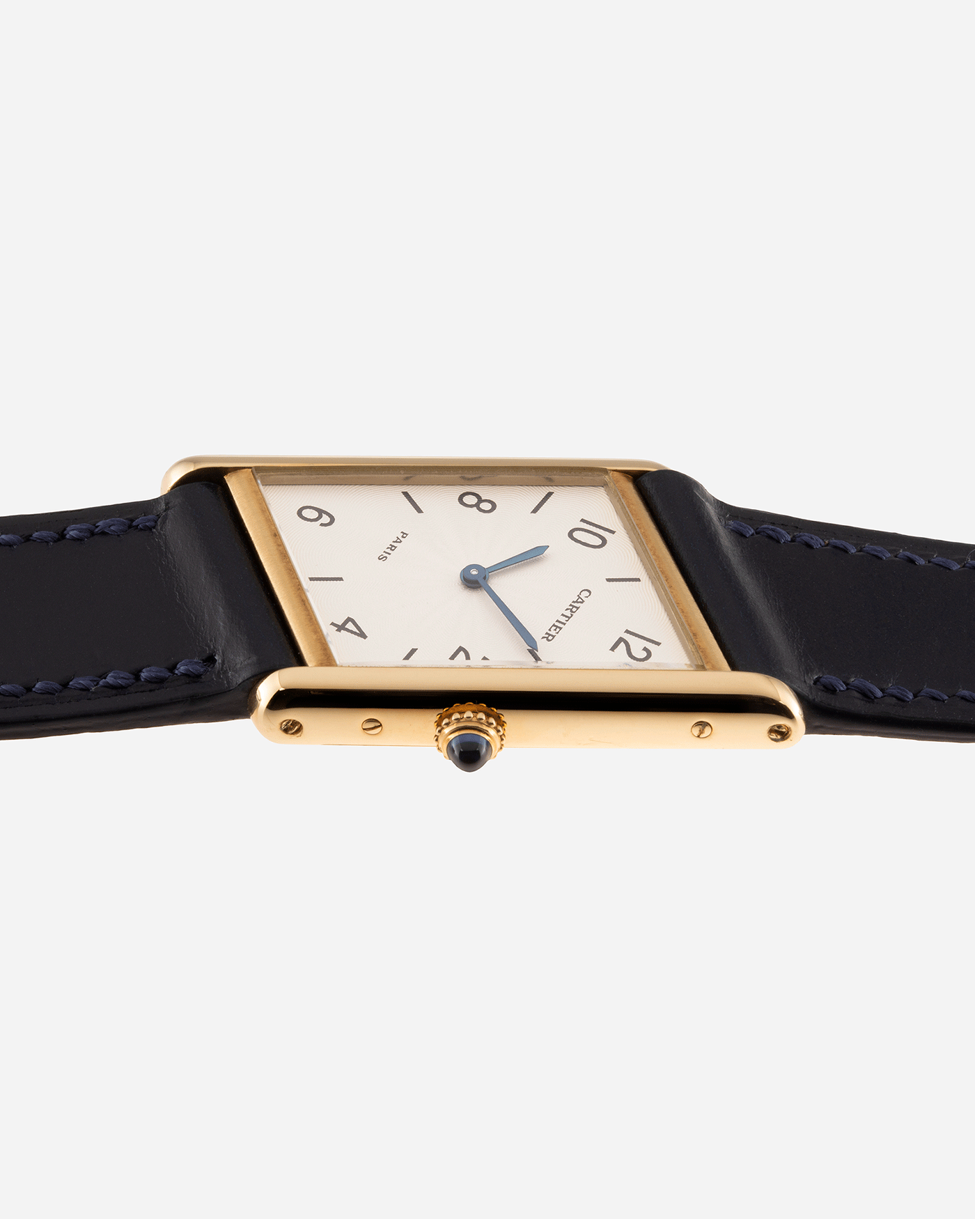 Brand: Cartier Year: 1996 Model: Tank Asymmetrique Limited Reference Number: 2488 Material: 18k Yellow Gold Movement: Cartier Cal. 9P2 Case Diameter: 23mm X 33mm Strap: Nostime Blue Leather with 18k Cartier Yellow Gold Deployant