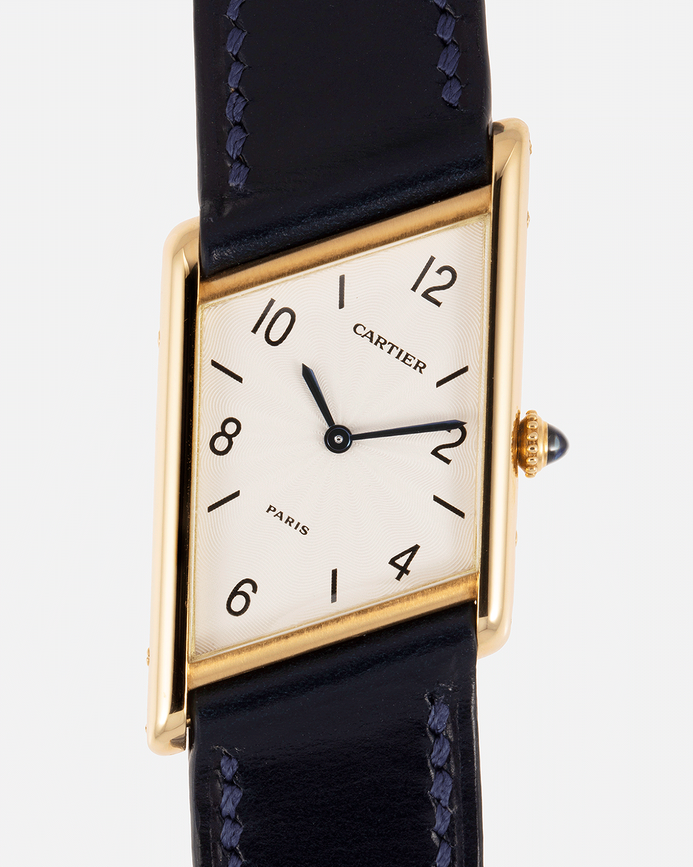 Brand: Cartier Year: 1996 Model: Tank Asymmetrique Limited Reference Number: 2488 Material: 18k Yellow Gold Movement: Cartier Cal. 9P2 Case Diameter: 23mm X 33mm Strap: Nostime Blue Leather with 18k Cartier Yellow Gold Deployant