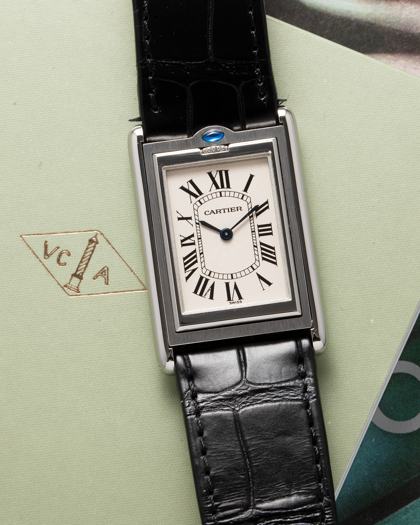 Brand: Cartier Year: 1990’s Model: Tank Basculante Reference: 2390 Material: Stainless Steel Movement: Piguet-derived Cartier cal. 050 MC Case Diameter: 26 x 38mm Strap: Black Cartier Alligator with Cartier Stainless Steel Tang Buckle